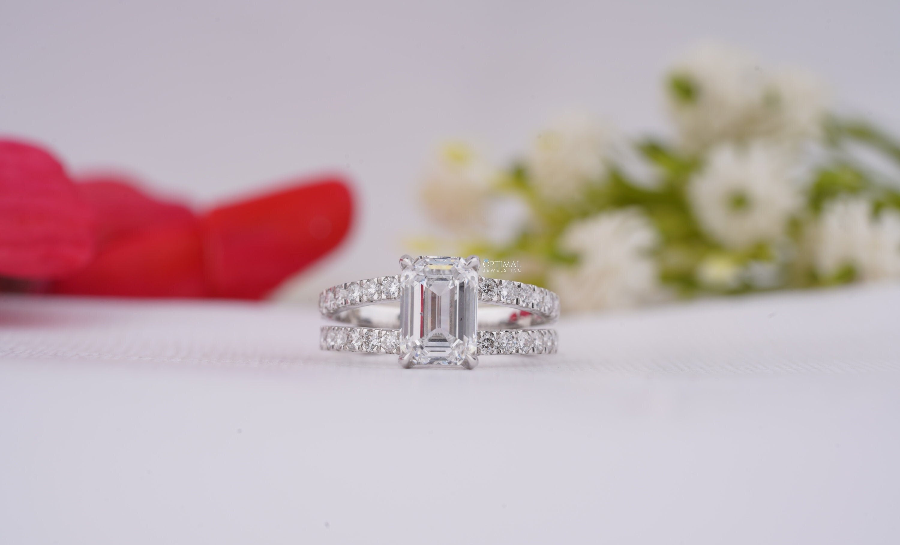 IGI Certified 2.74 Ctw Emerald Cut Lab Grown Diamond Ring in 18K White Gold, featuring a double band and pave set design.