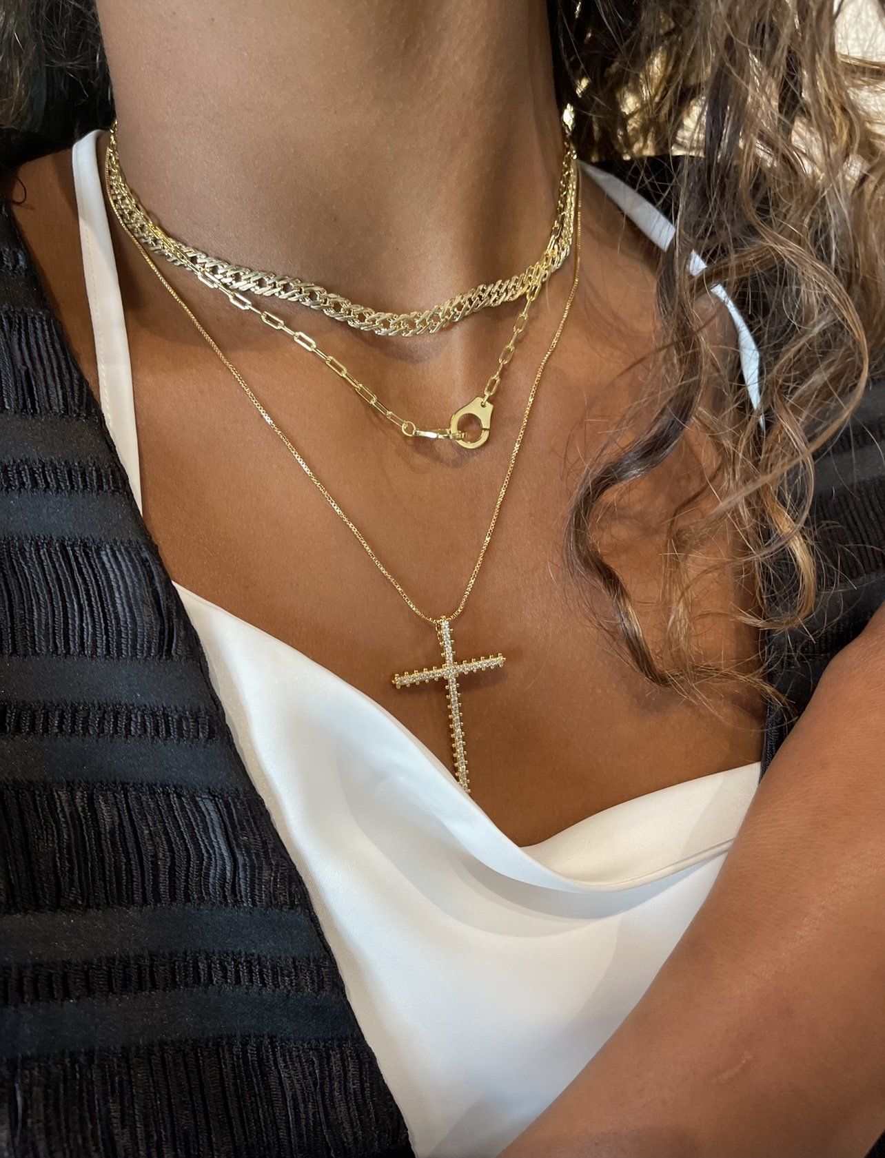 Incanto Maxi Cross Necklace featuring a stylish gold-plated cross adorned with pink cubic zirconia on a delicate chain.