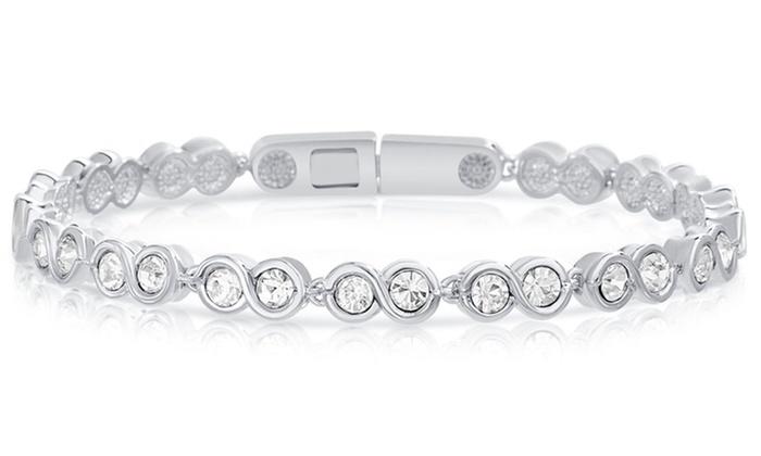 Elegant Infinity Tennis Bracelet featuring sparkling Austrian crystals set in a round design, crafted from brass with rhodium plating.