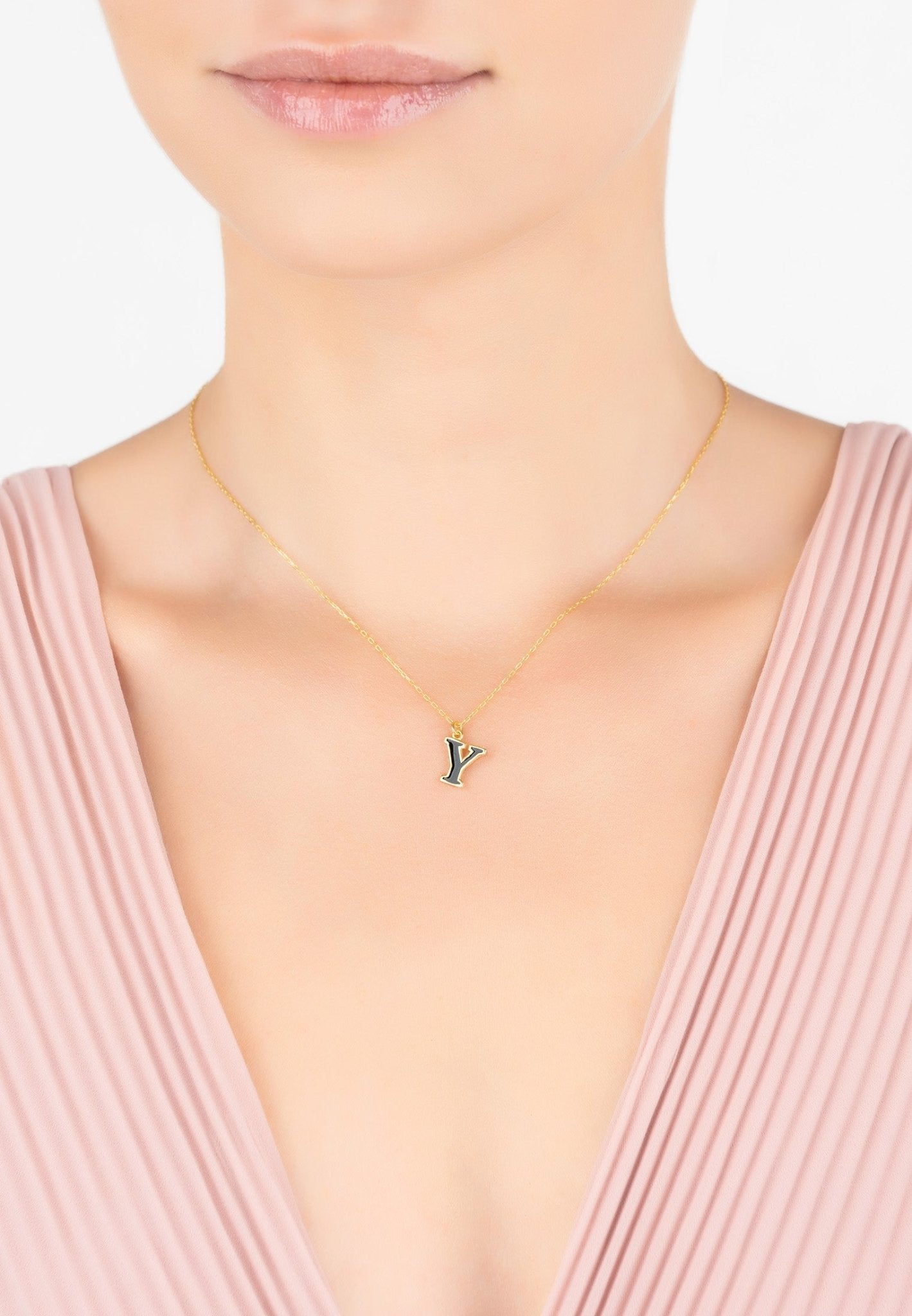 Initial Enamel Necklace Gold Y featuring a black enamel pendant on a delicate gold chain, elegantly displayed in a jewelry box.