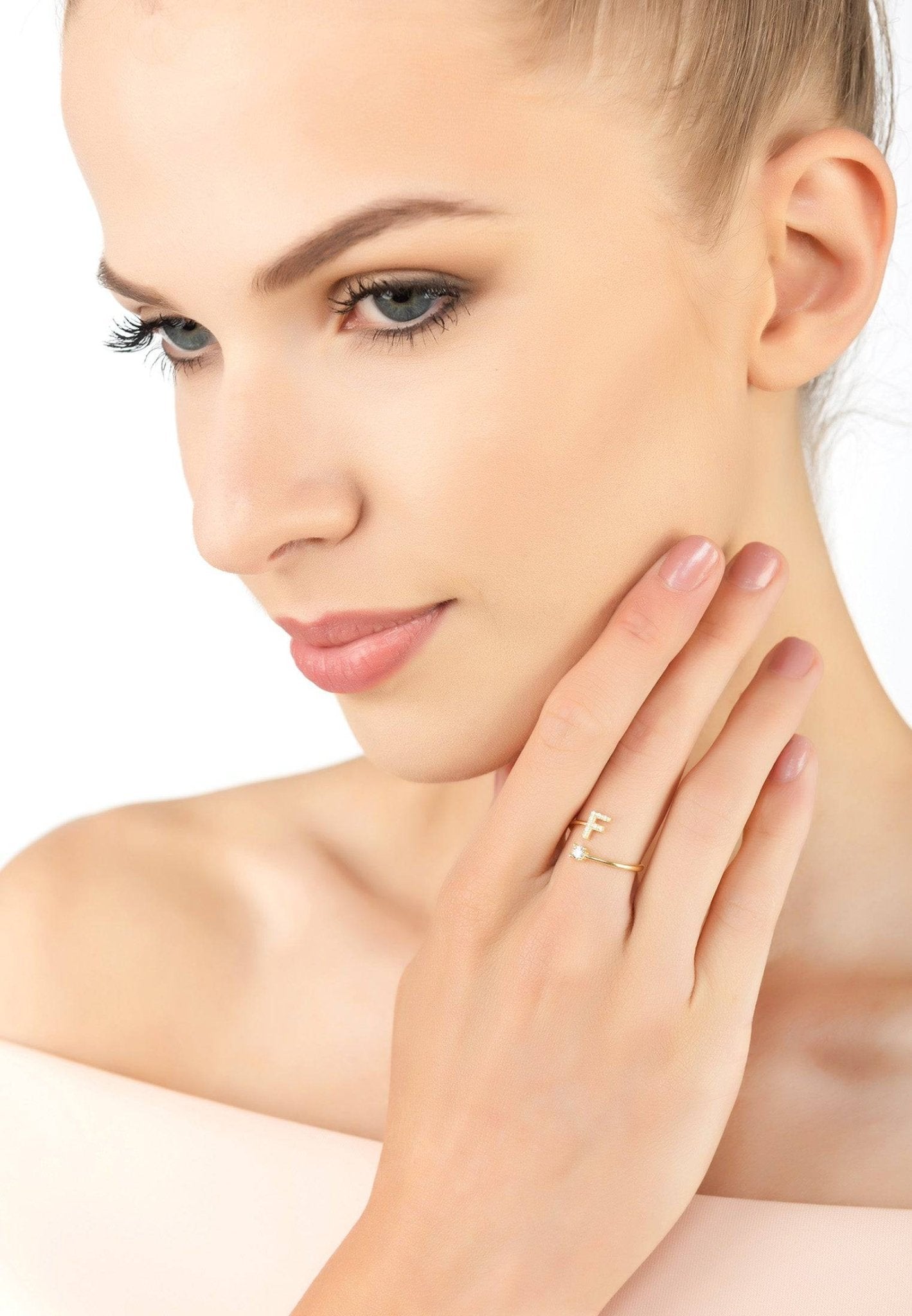 Initial Ring Gold F featuring a delicate design with cubic zirconia accents, handcrafted from sterling silver and dipped in 22ct gold.