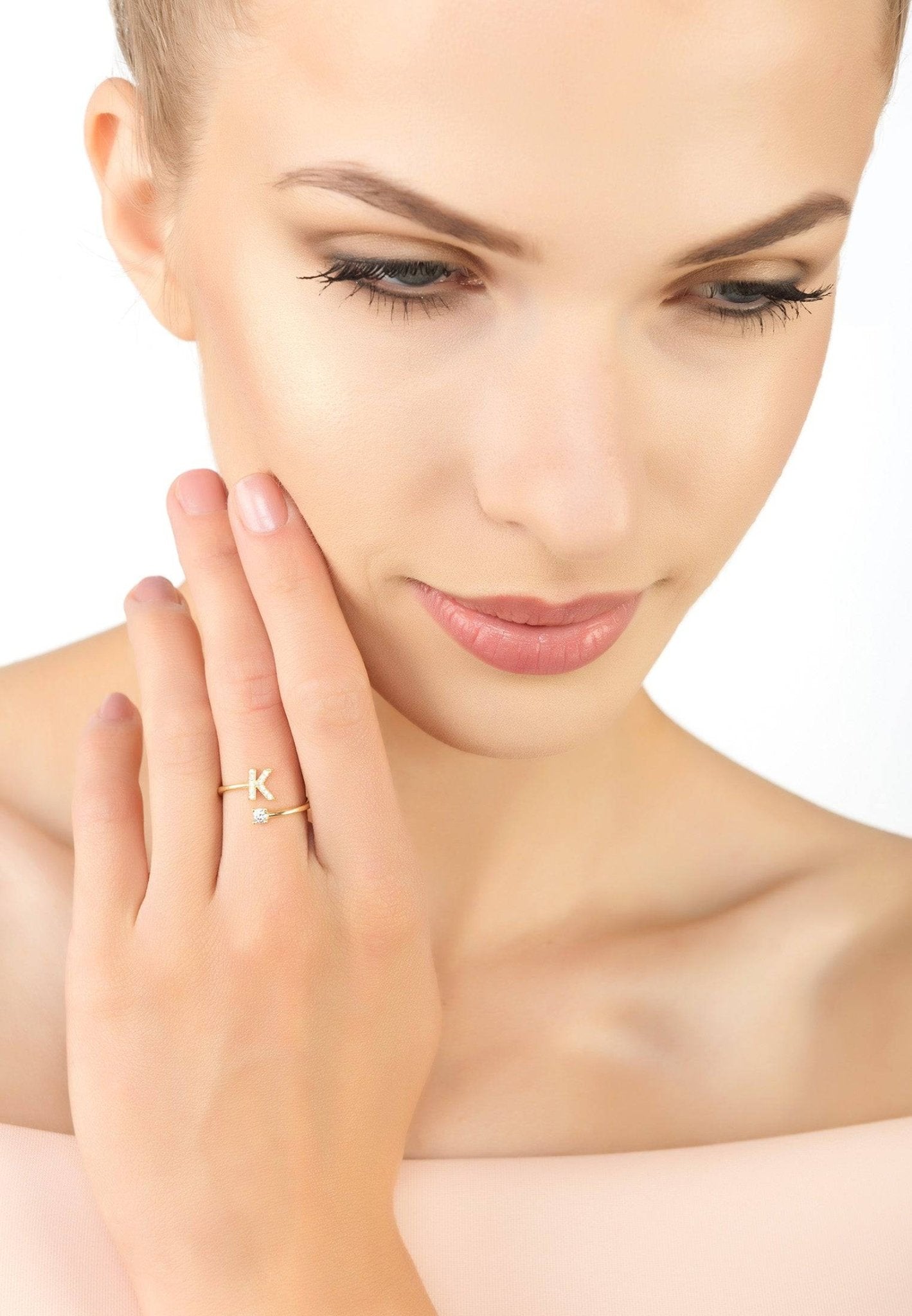 Elegant Initial Ring Gold K featuring a delicate design with cubic zirconia, handcrafted from sterling silver and dipped in 22ct gold.