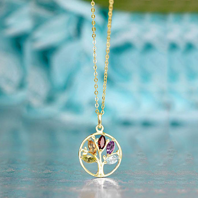 Iridescent Tree of Life Amethyst Crystal Disc Pendant Necklace featuring 14K gold plating and a stunning purple amethyst crystal.