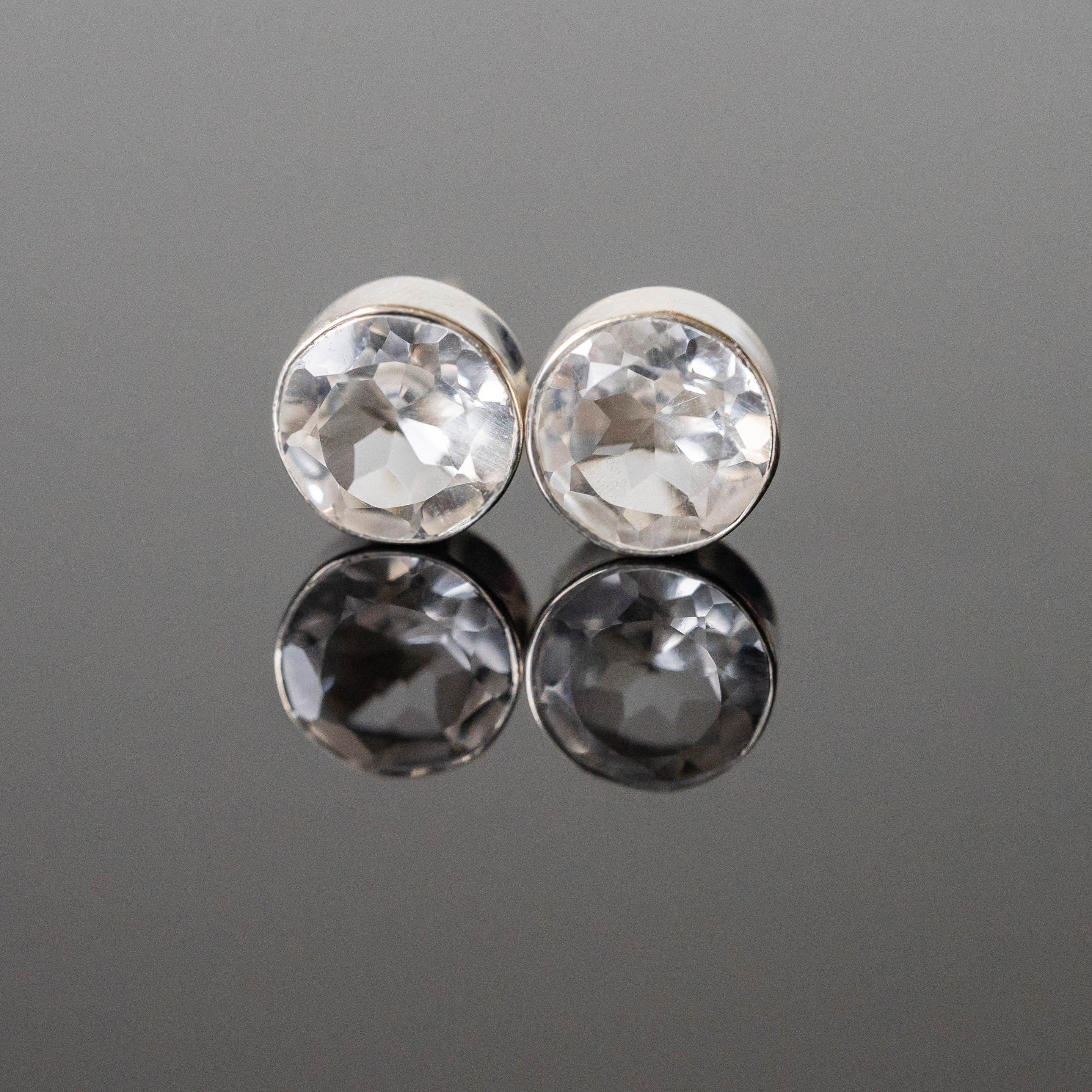 Isabel Crystal Quartz Round Studs in silver with 8 mm clear quartz stones, elegantly displayed in gift-ready packaging.