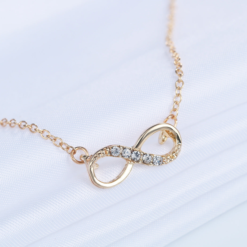 Italian Pav’e Infinity Necklace featuring a 14K gold plated infinity pendant on a link chain, perfect for elegant occasions.