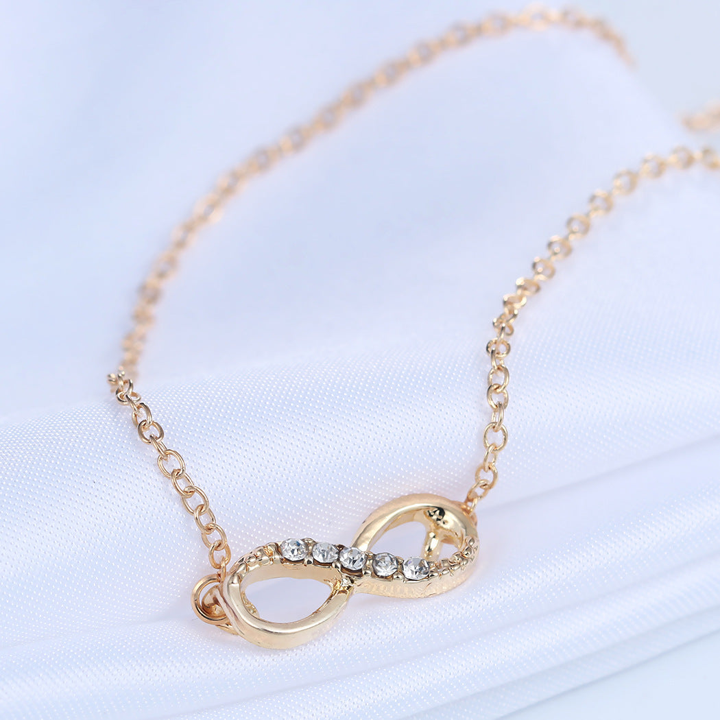 Italian Pav’e Infinity Necklace featuring a 14K gold plated infinity pendant on a link chain, perfect for elegant occasions.