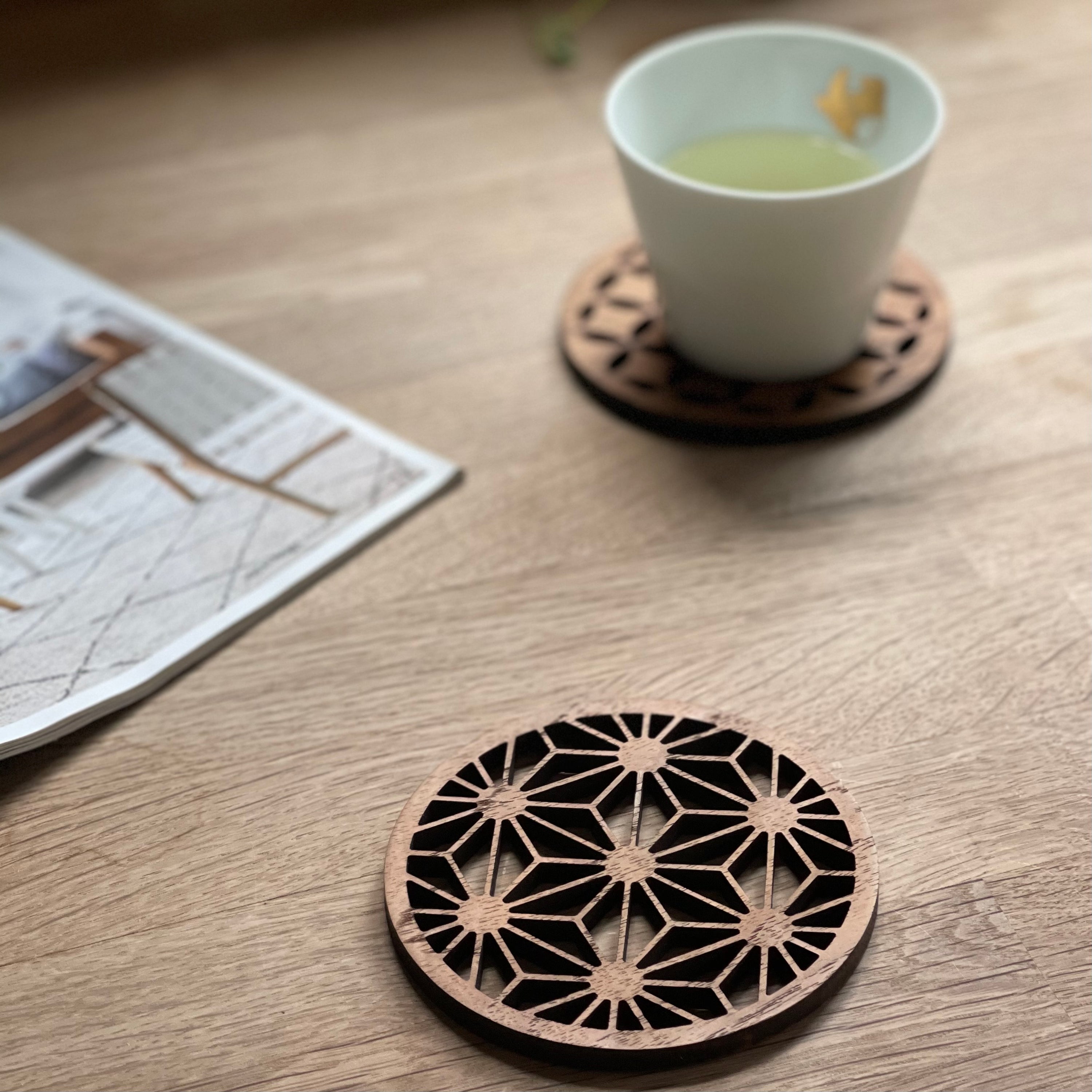Set of four Japanese patterns upcycled teak wood coasters, showcasing unique designs and eco-friendly craftsmanship.