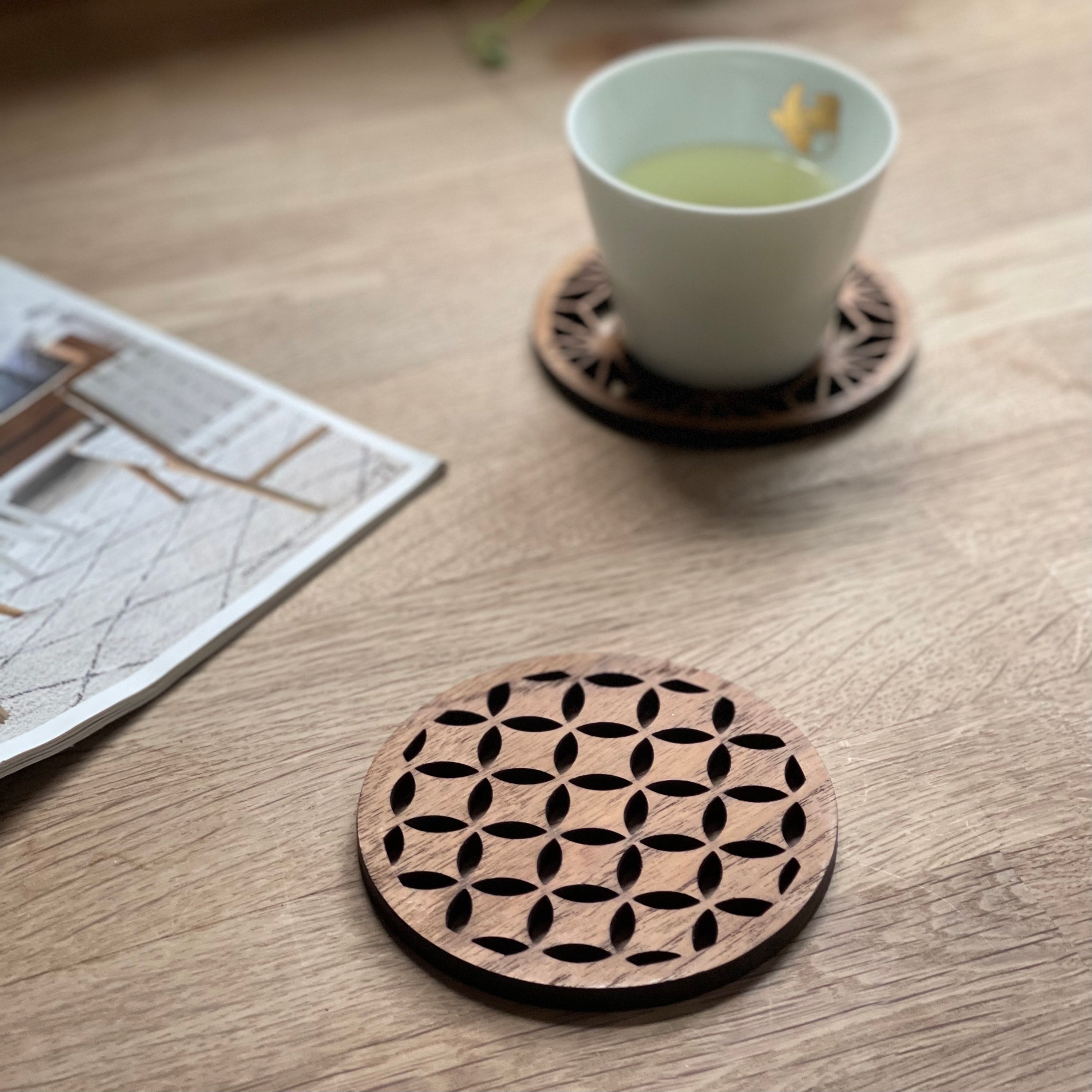 Set of four Japanese patterns upcycled teak wood coasters, showcasing unique designs and eco-friendly craftsmanship.