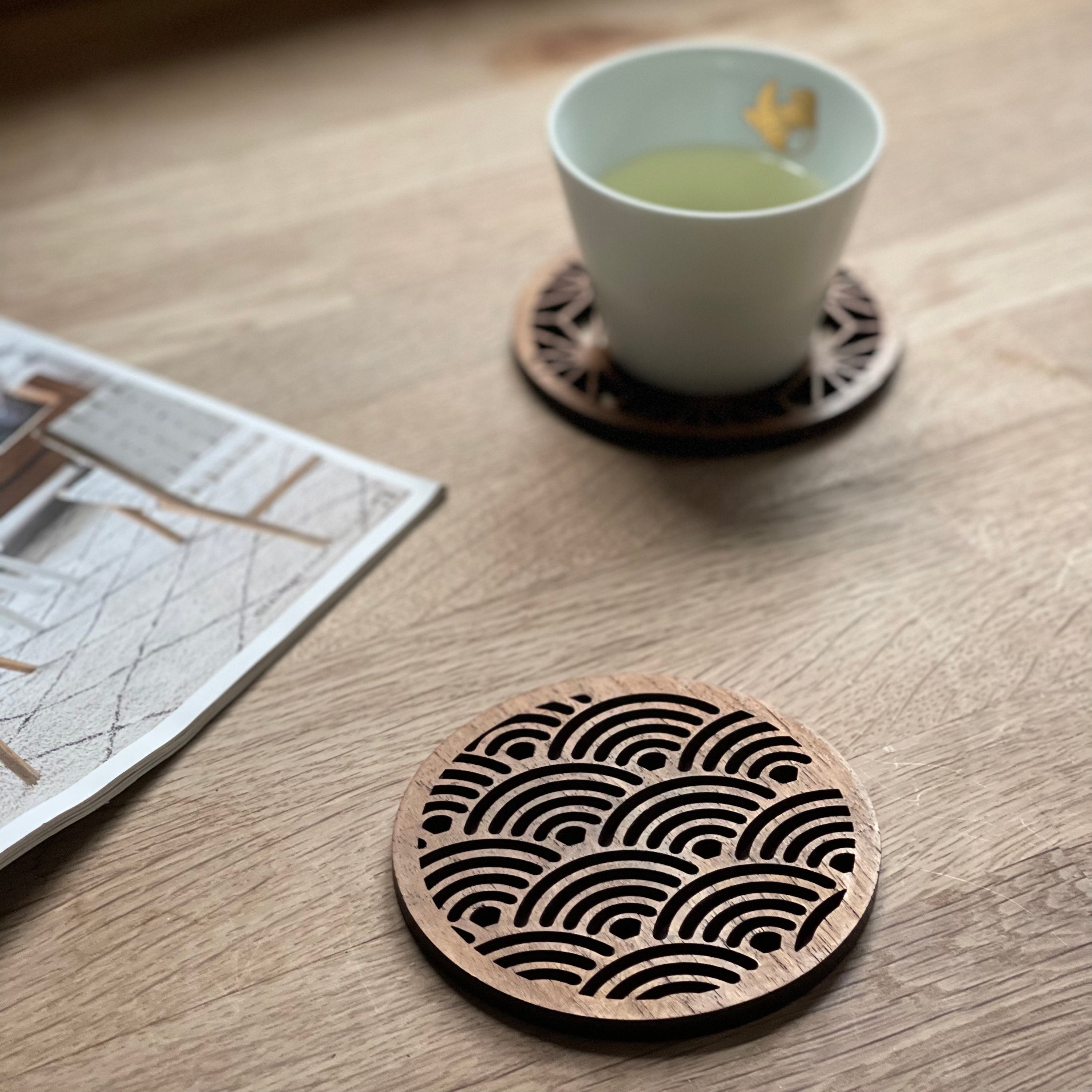 Set of four Japanese patterns upcycled teak wood coasters, showcasing unique designs and eco-friendly craftsmanship.