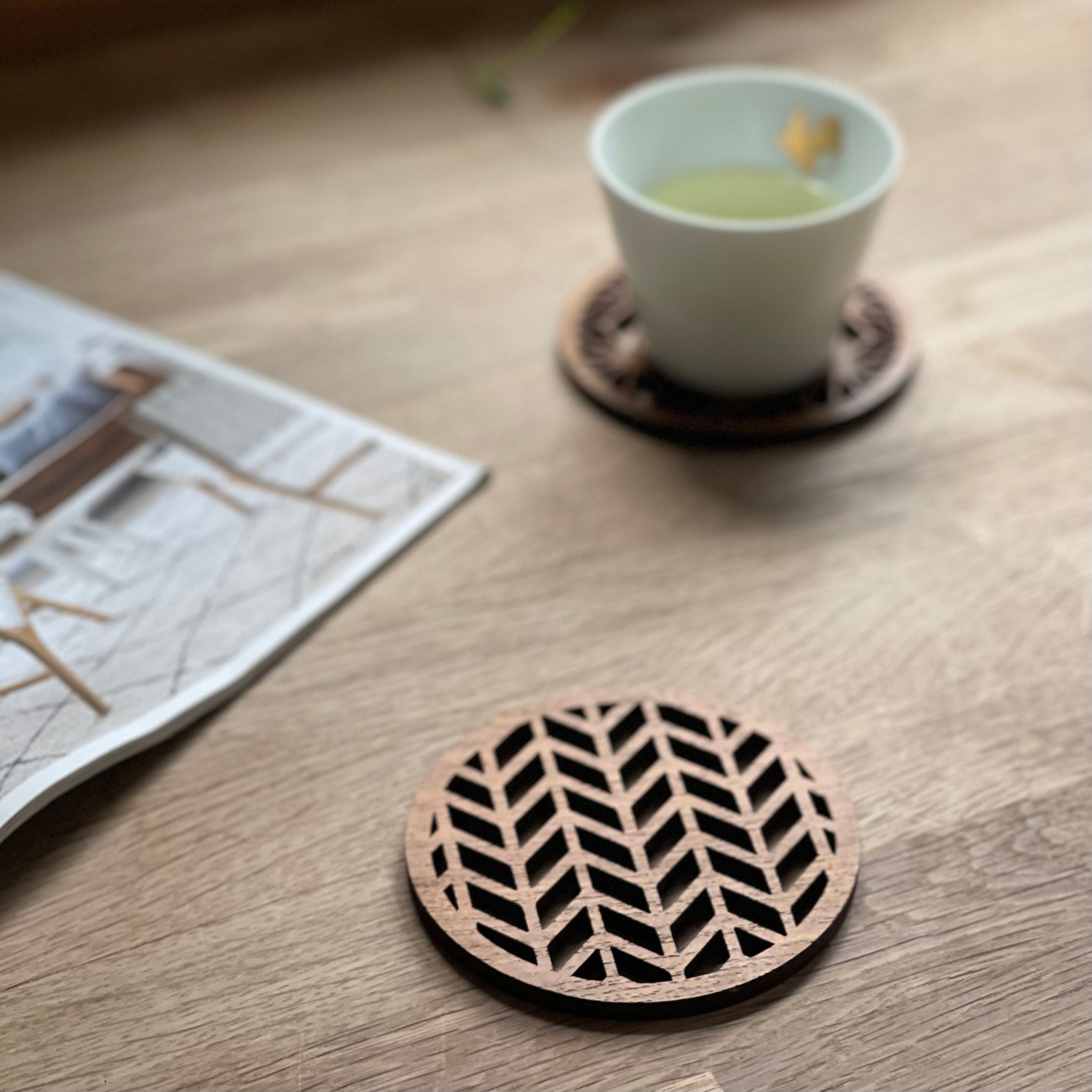 Set of four Japanese patterns upcycled teak wood coasters, showcasing unique designs and eco-friendly craftsmanship.