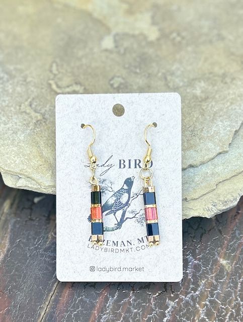 A pair of elegant Jet Black, Gold & Shiny Red Tila Bead Earrings showcasing vibrant colors and unique design.