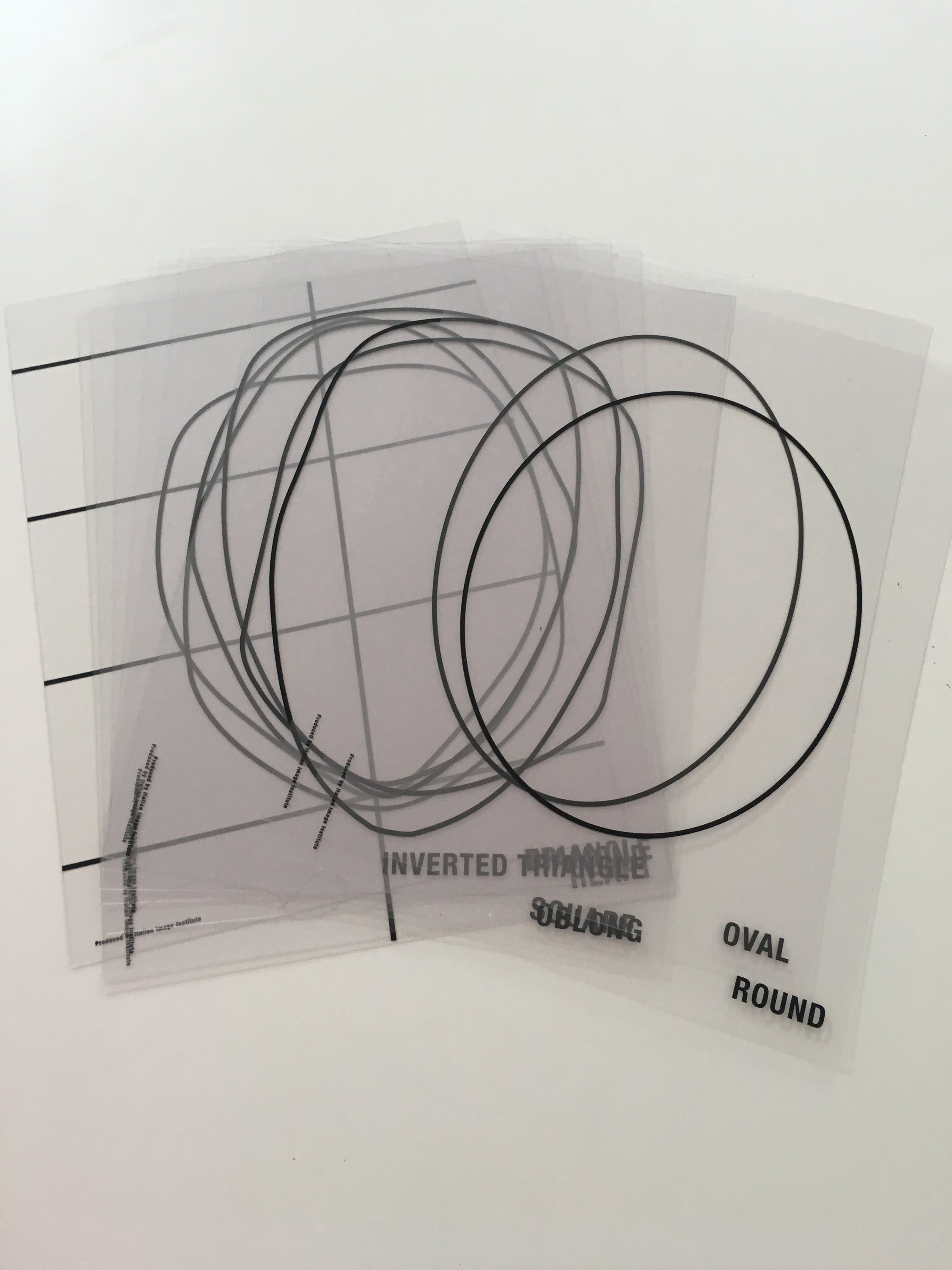 A woman participating in an online jewelry styling session, showcasing various jewelry pieces and accessories, with a laptop in front of her.