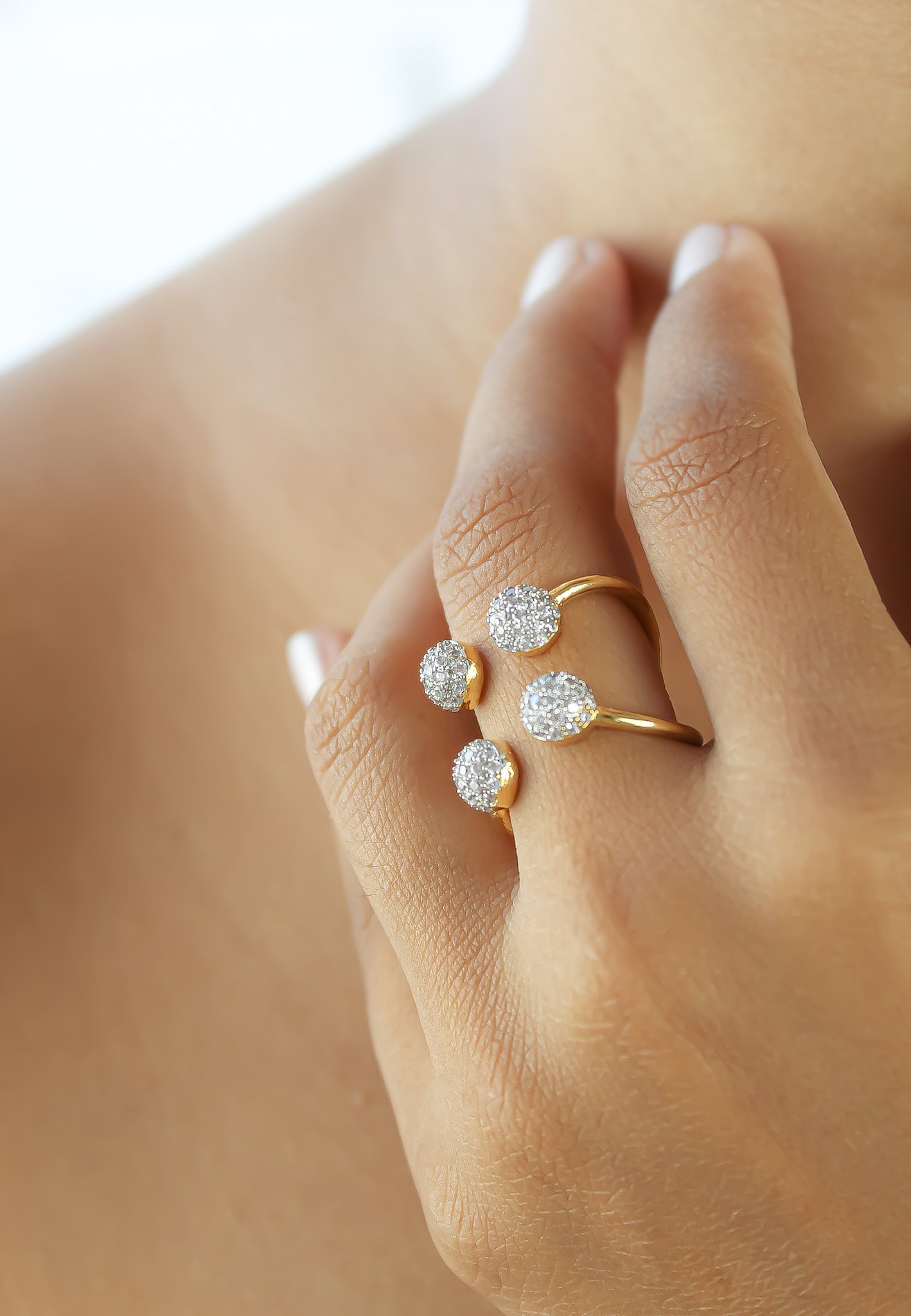 Joy Ring featuring 18K gold plating and adjustable design, elegantly displayed against a soft background.
