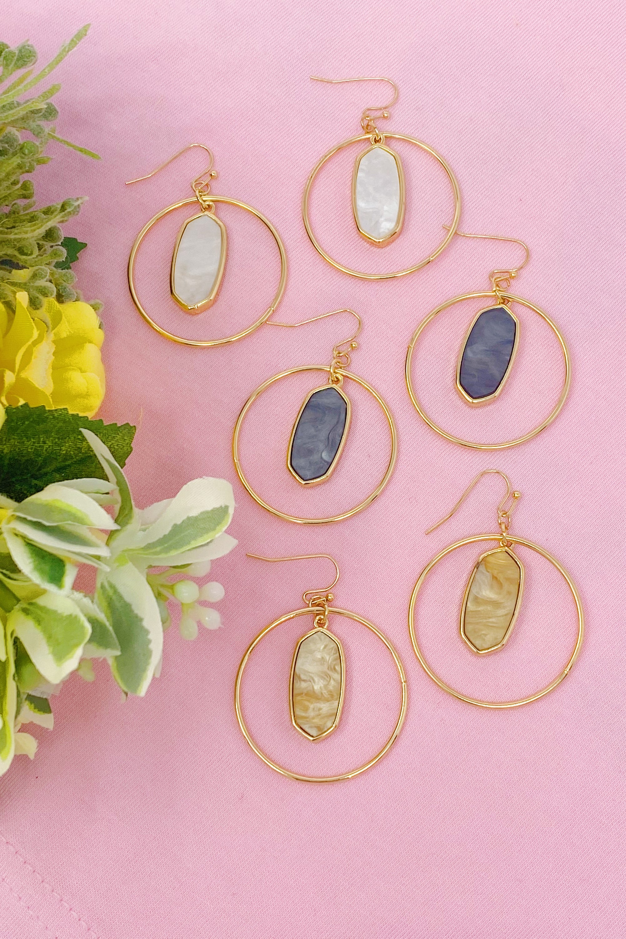 Kenzie Circle Drop Earrings featuring a dangling hoop design with a beautiful center piece, crafted from alloy metal.