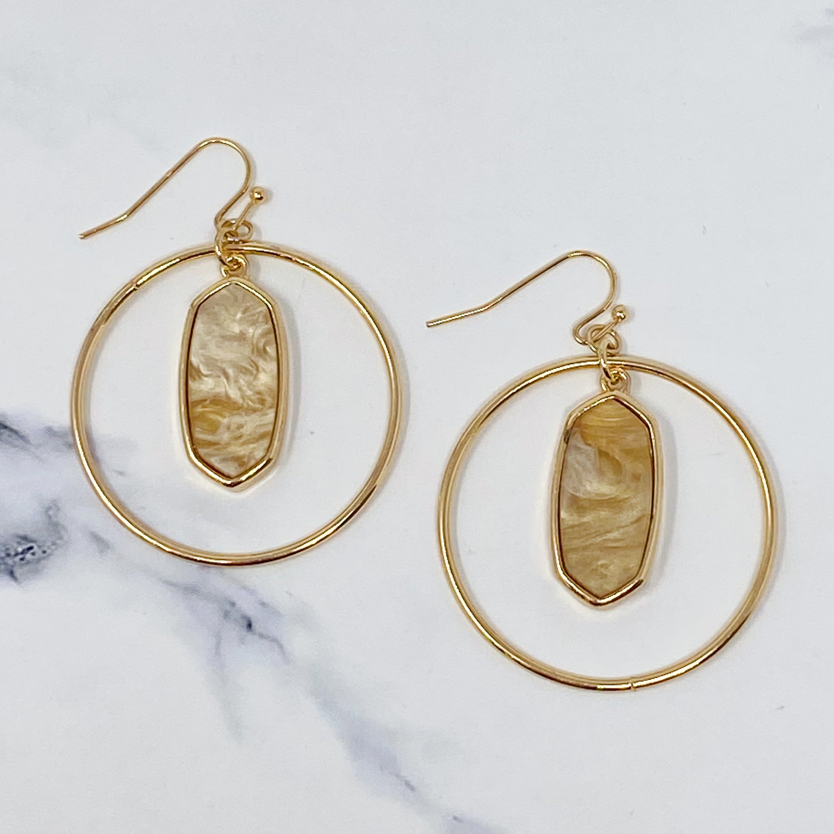 Kenzie Circle Drop Earrings featuring a dangling hoop design with a beautiful center piece, crafted from alloy metal.
