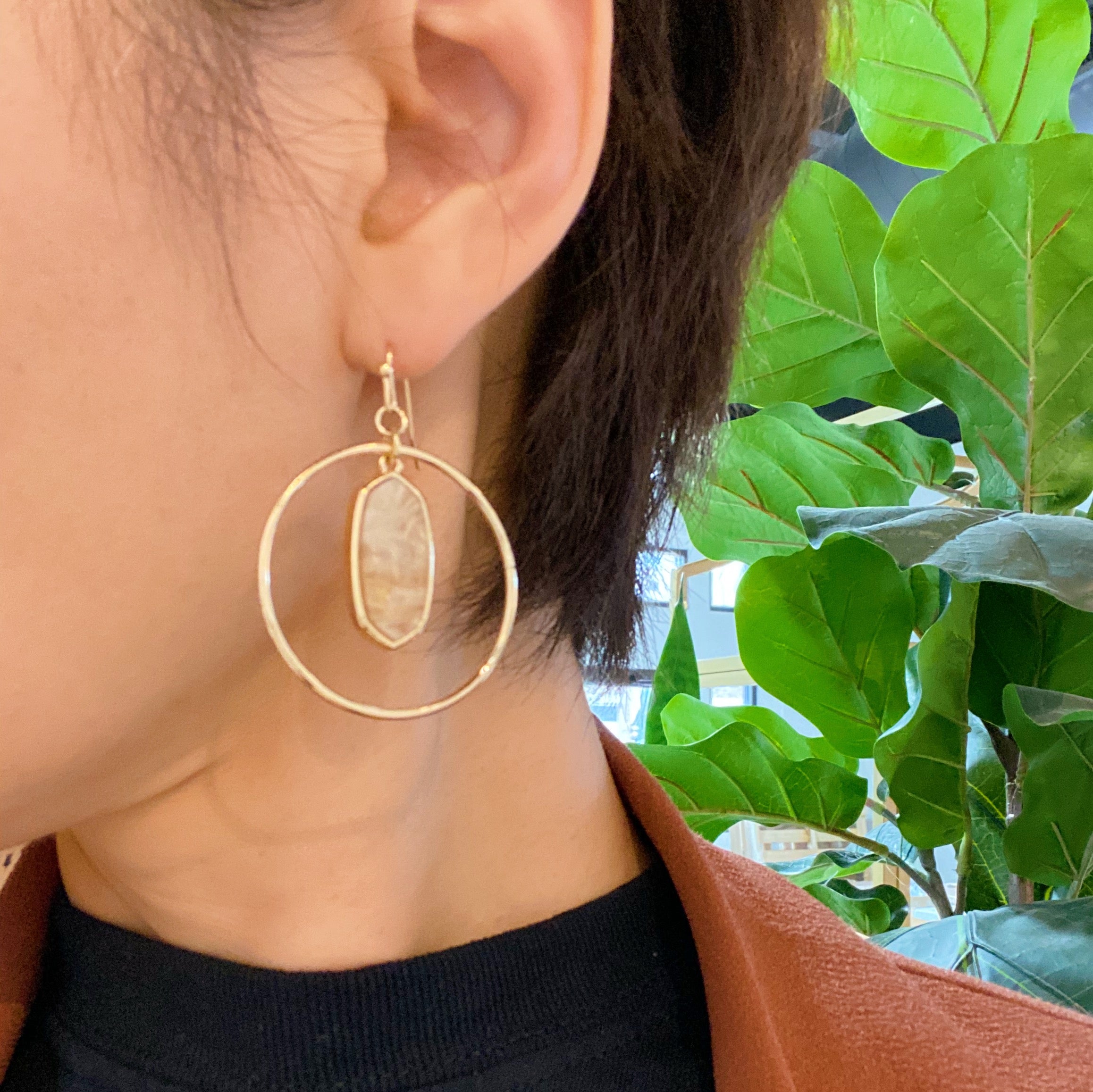 Kenzie Circle Drop Earrings featuring a dangling hoop design with a beautiful center piece, crafted from alloy metal.