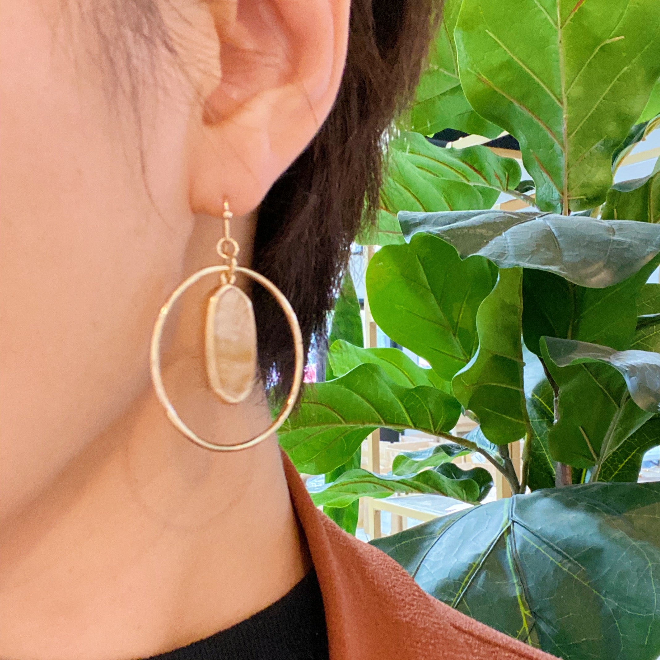 Kenzie Circle Drop Earrings featuring a dangling hoop design with a beautiful center piece, crafted from alloy metal.