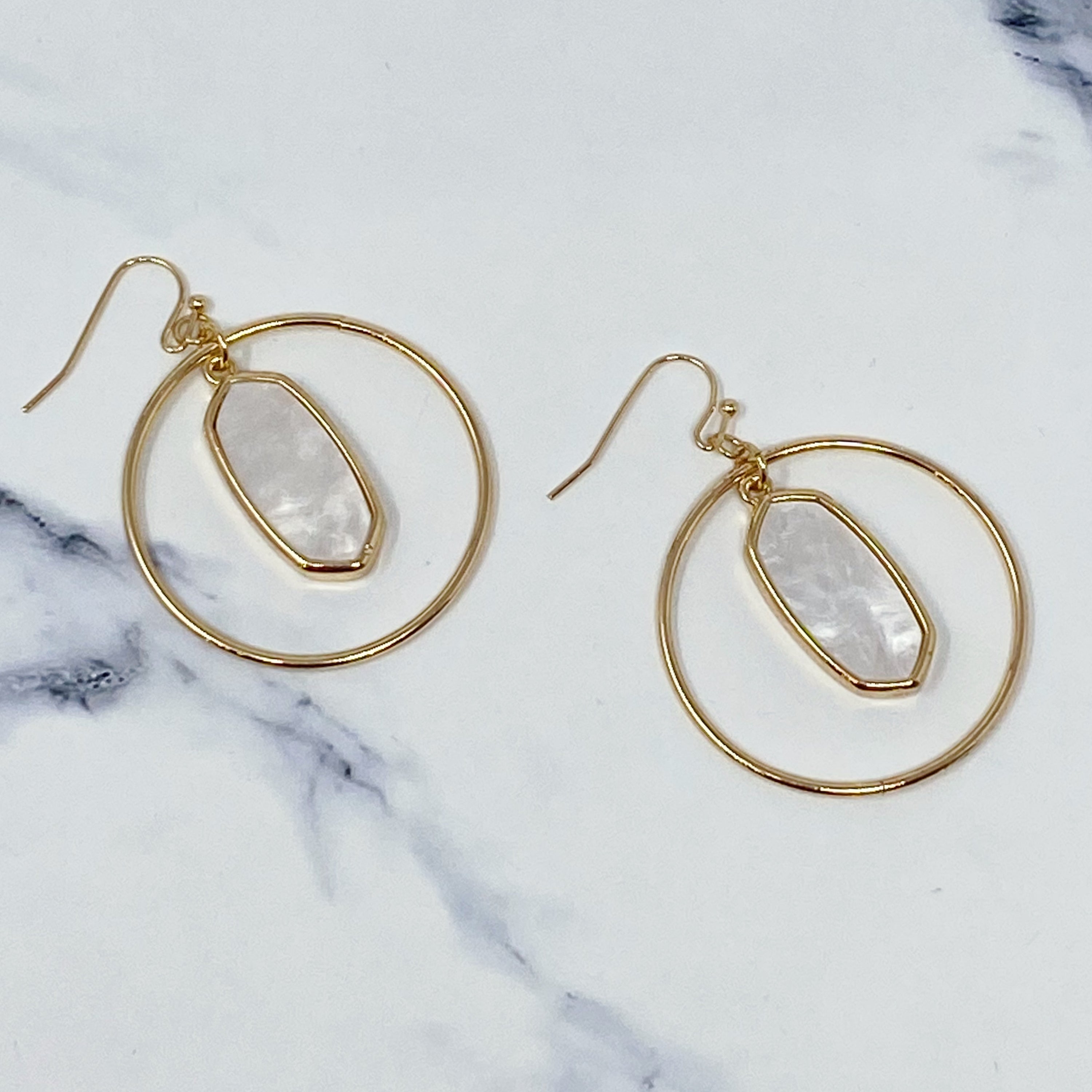 Kenzie Circle Drop Earrings featuring a dangling hoop design with a beautiful center piece, crafted from alloy metal.