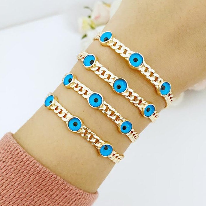 A beautiful handmade Knitting Cuff Bracelet featuring a blue evil eye charm, crafted from tarnish-resistant 316L stainless steel in a gold finish.