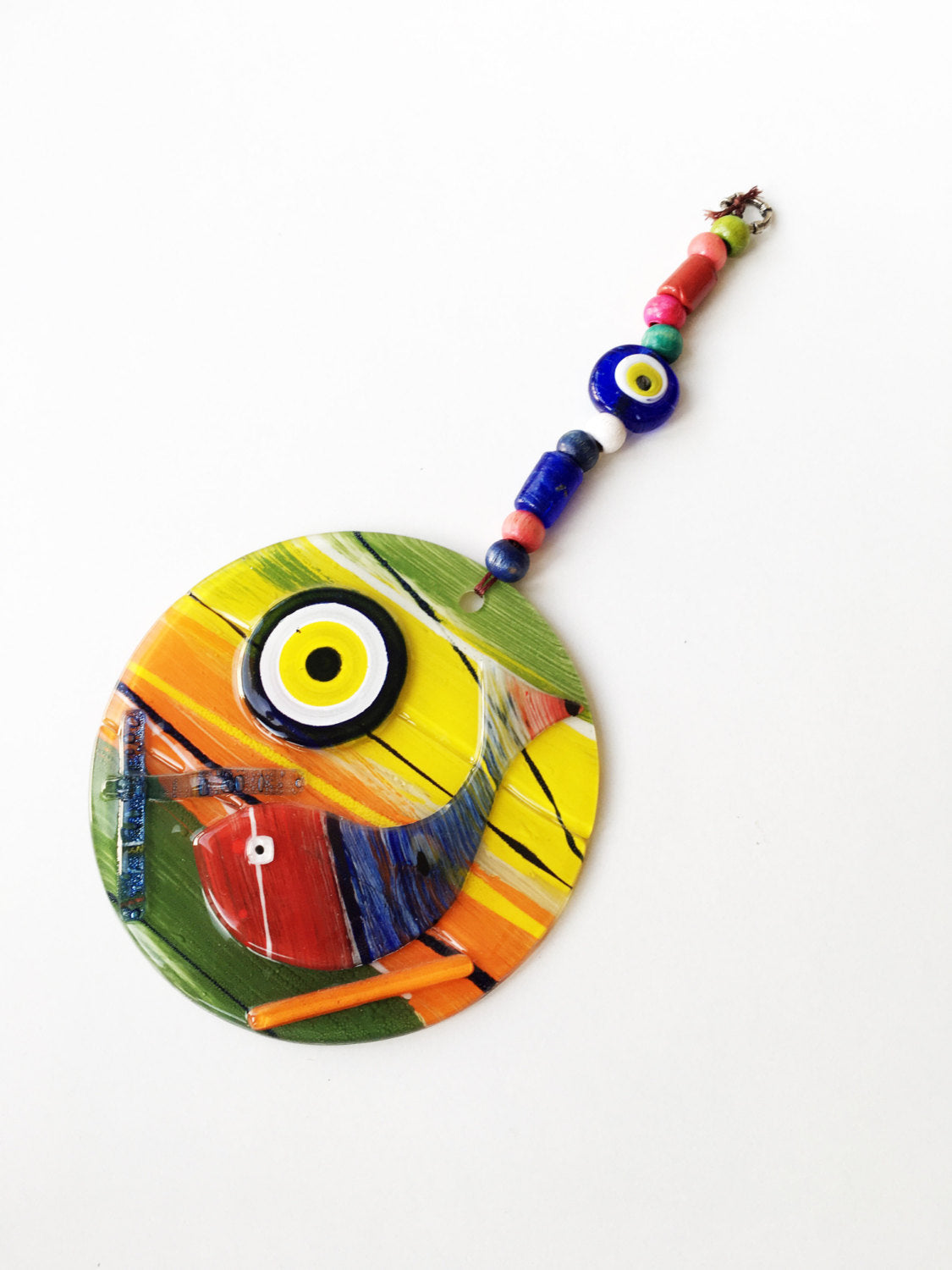 A vibrant Lampwork Turkish Evil Eye Wall Hanging featuring a unique mosaic design, measuring 12cm x 12cm, perfect for home decor.