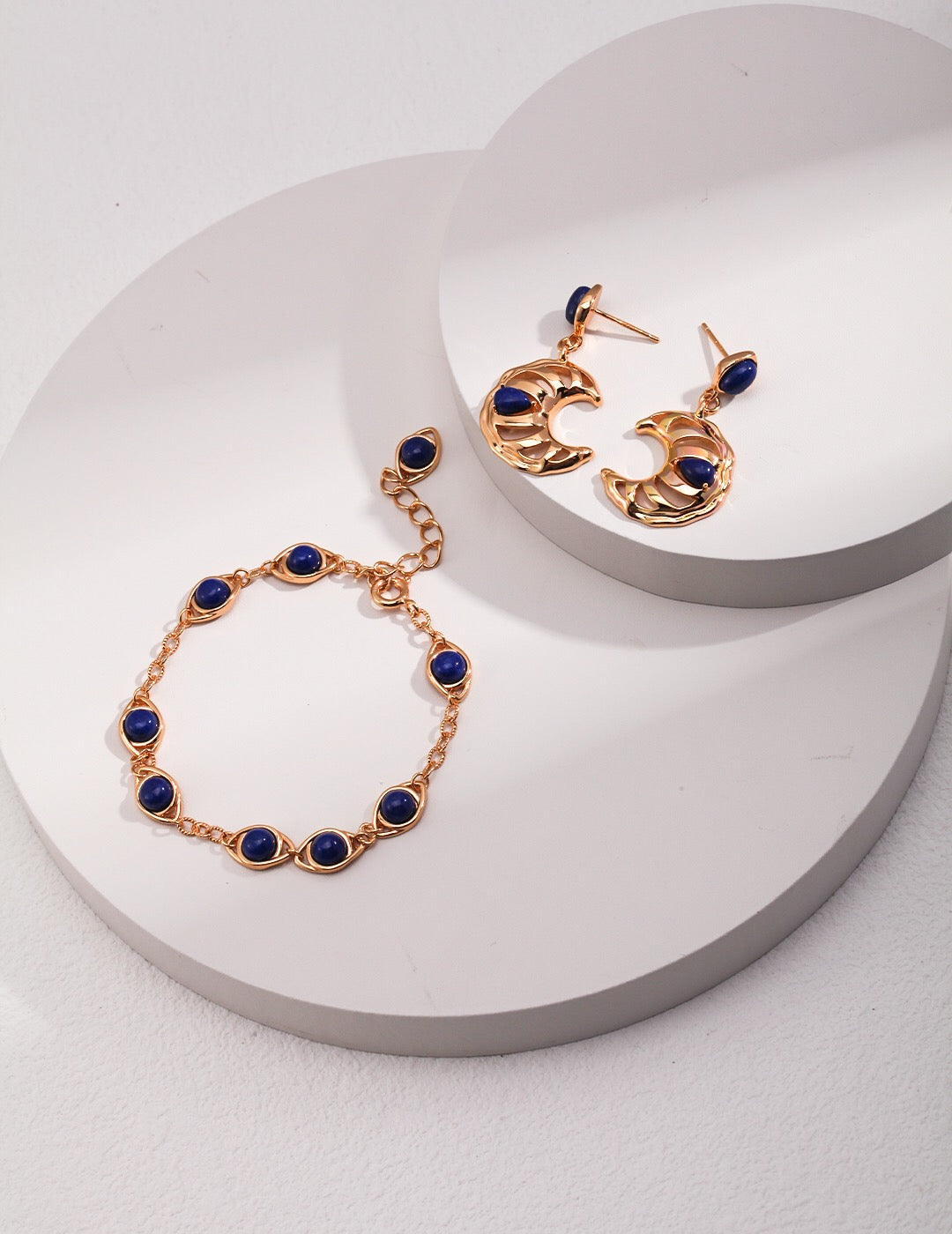 Handmade Lapis Lazuli Crescent Moon Hollow Earrings with gold vermeil setting, showcasing a unique crescent moon design.