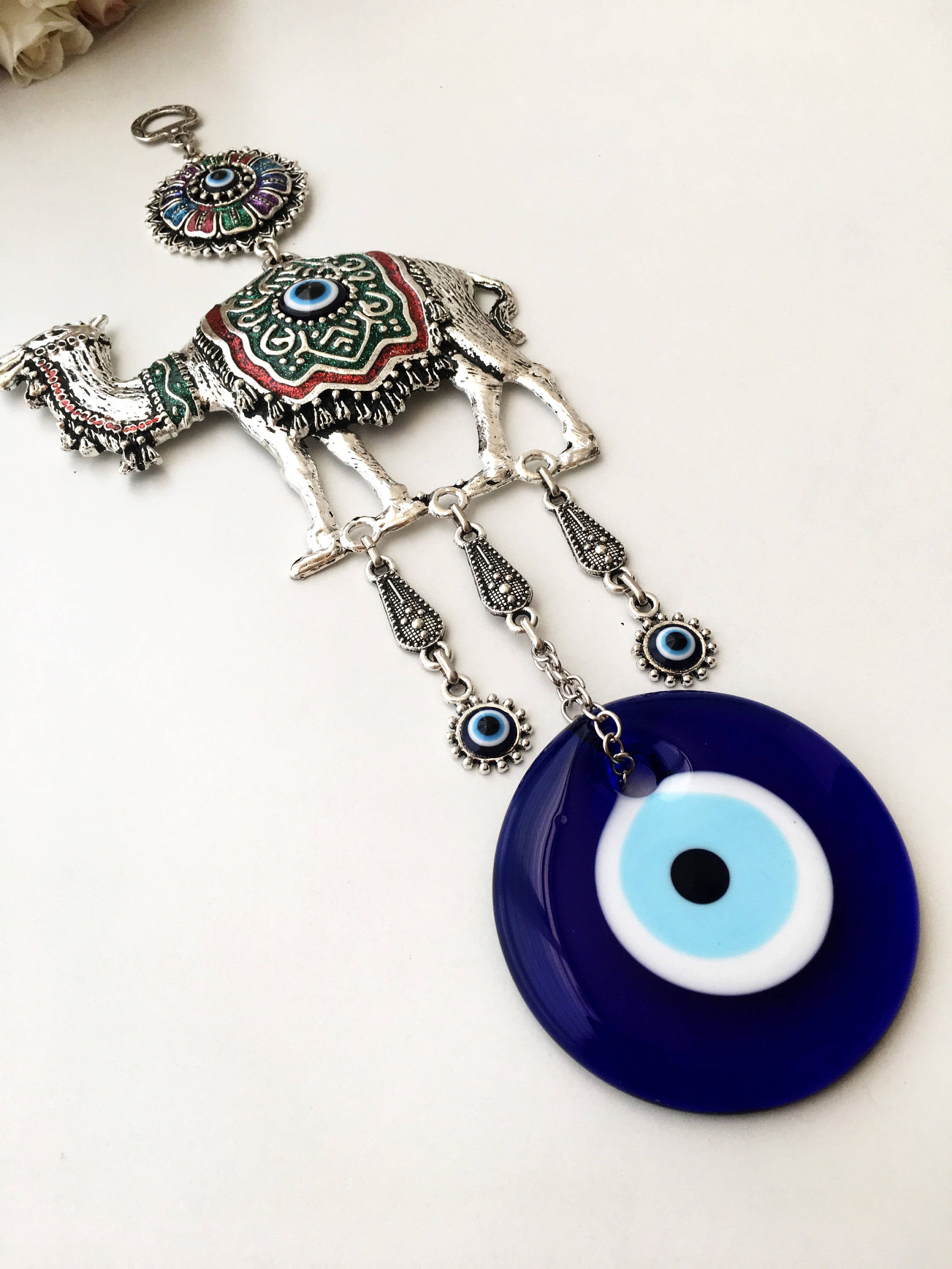 Large Camel Evil Eye Wall Hanging featuring unique handmade design with large evil eye beads and metal camel charm.
