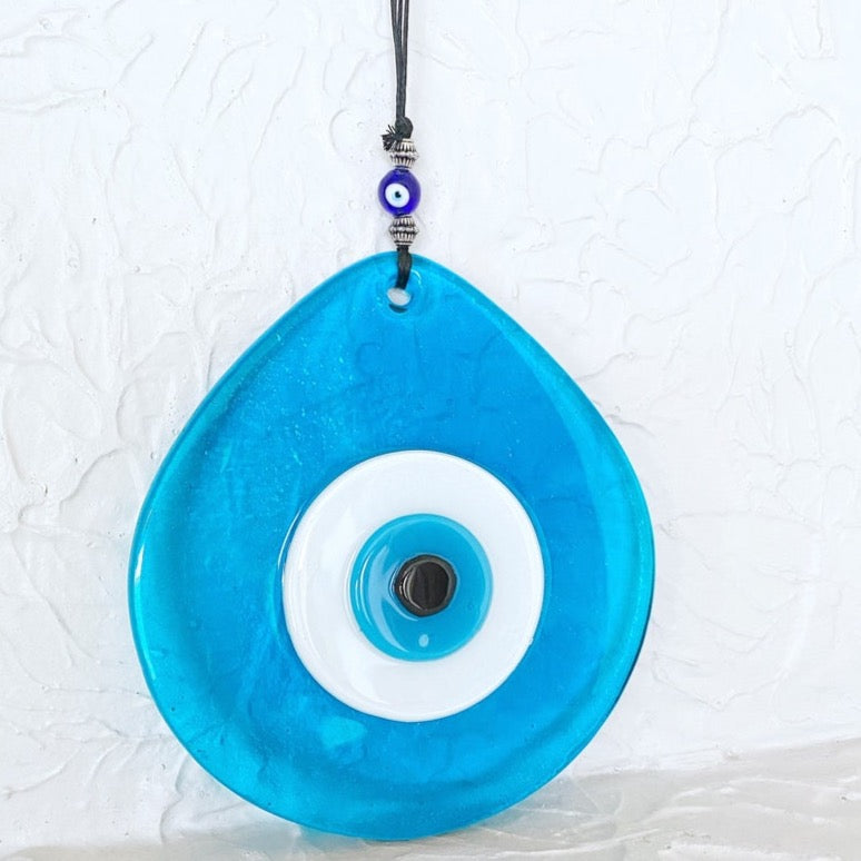 Large blue evil eye bead wall decor made of mosaic glass, symbolizing protection and good luck, elegantly designed for home decoration.