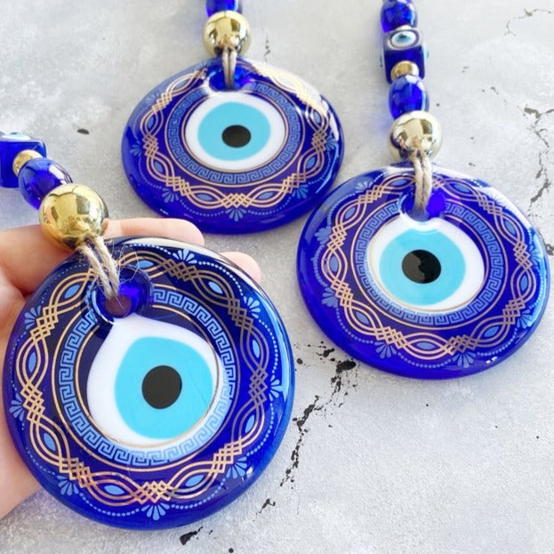 Large Round Blue Evil Eye Wall Hanging featuring intricate patterns, symbolizing protection and good luck, perfect for home decor.