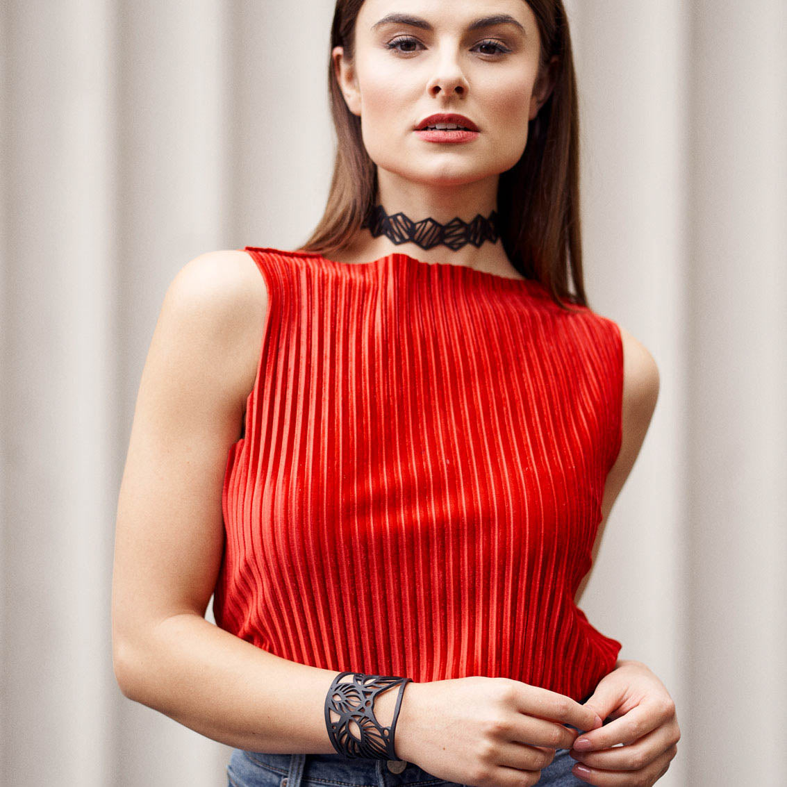 Leaf Art Nouveau Inner Tube Bracelet made from reclaimed rubber, featuring unique textures and a plastic button closure.