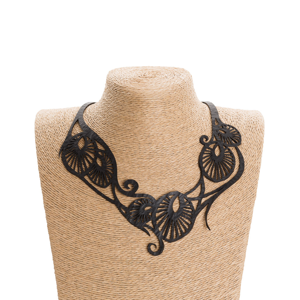 Leaf Art Nouveau Inner Tube Necklace made from reclaimed rubber, showcasing unique patterns and eco-friendly design.