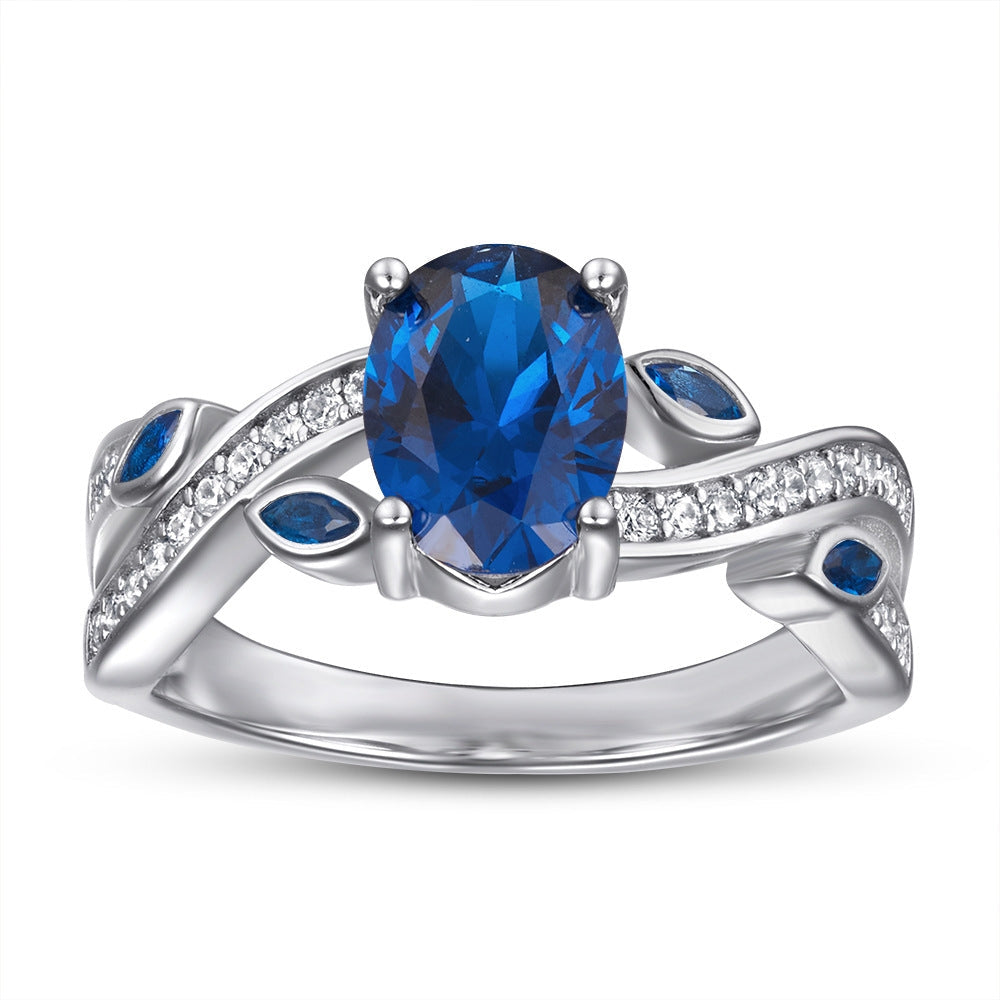 Leaf Band Fantastic Jewelry Ring made of 925 sterling silver with white gold finish, featuring white sapphire and blue zirconia stones.