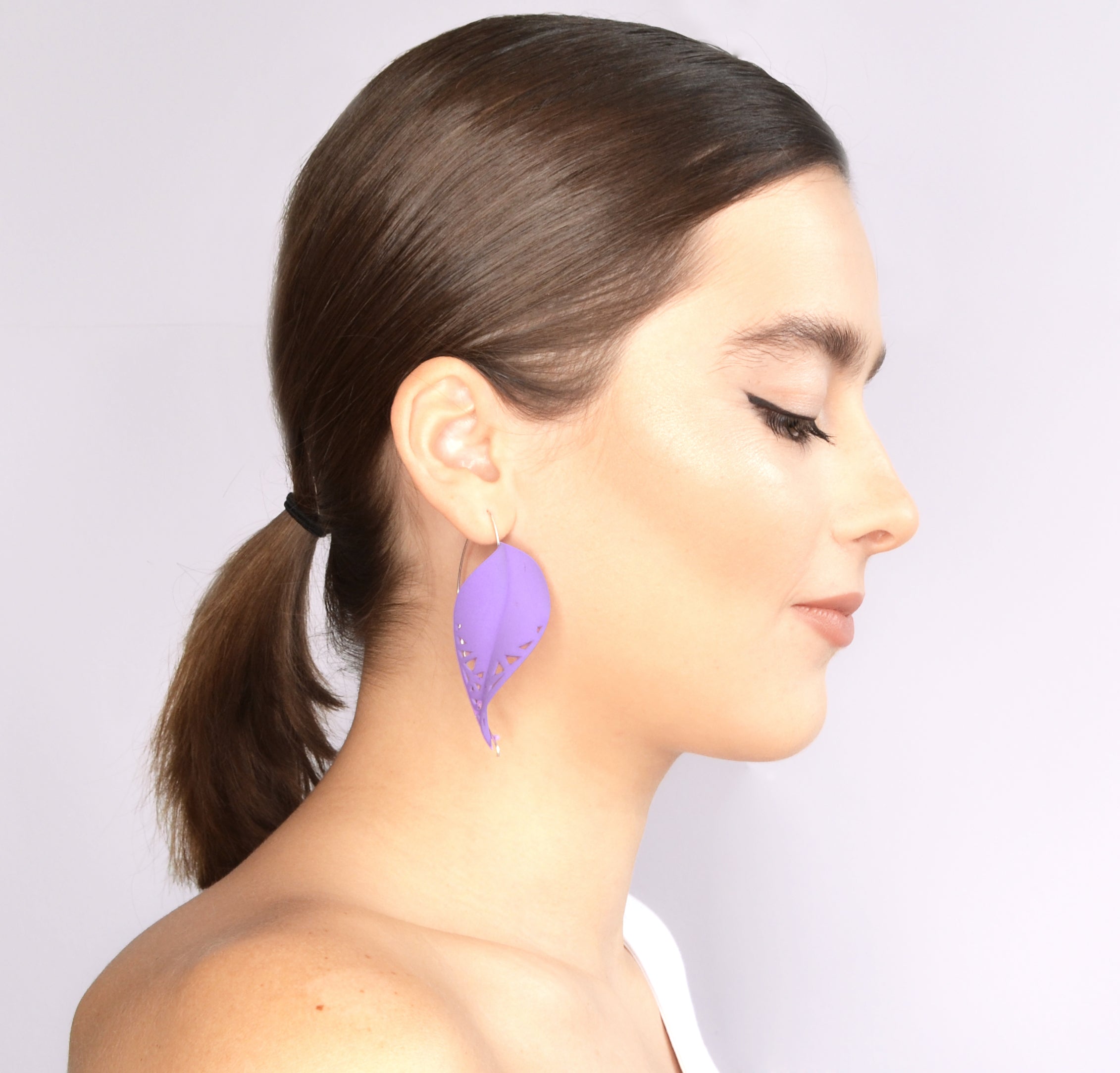 Oversize Leaf Earrings in vibrant colors inspired by rainforest flora, featuring a lightweight design and hypoallergenic materials.
