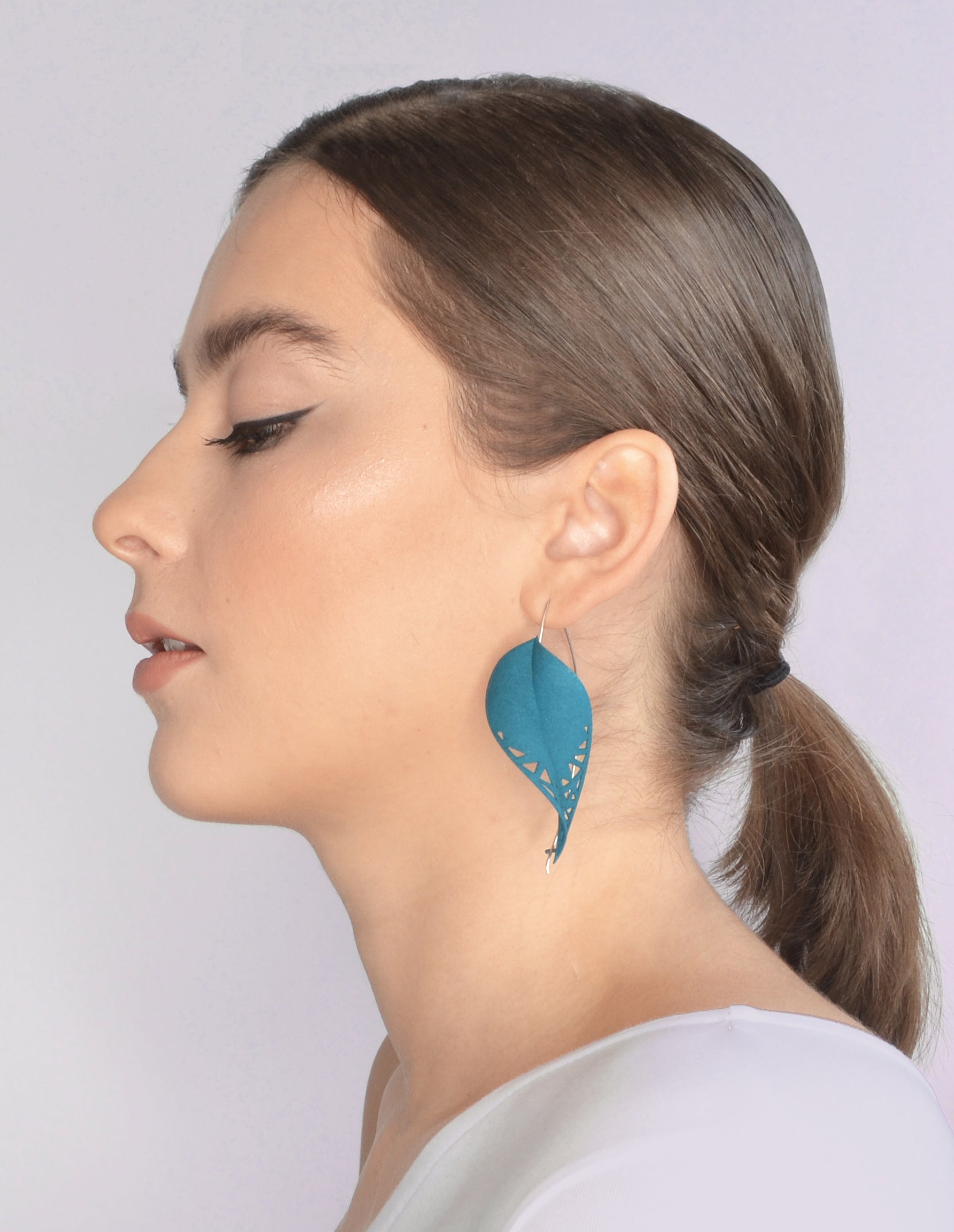 Oversize Leaf Earrings in vibrant colors inspired by rainforest flora, featuring a lightweight design and hypoallergenic materials.