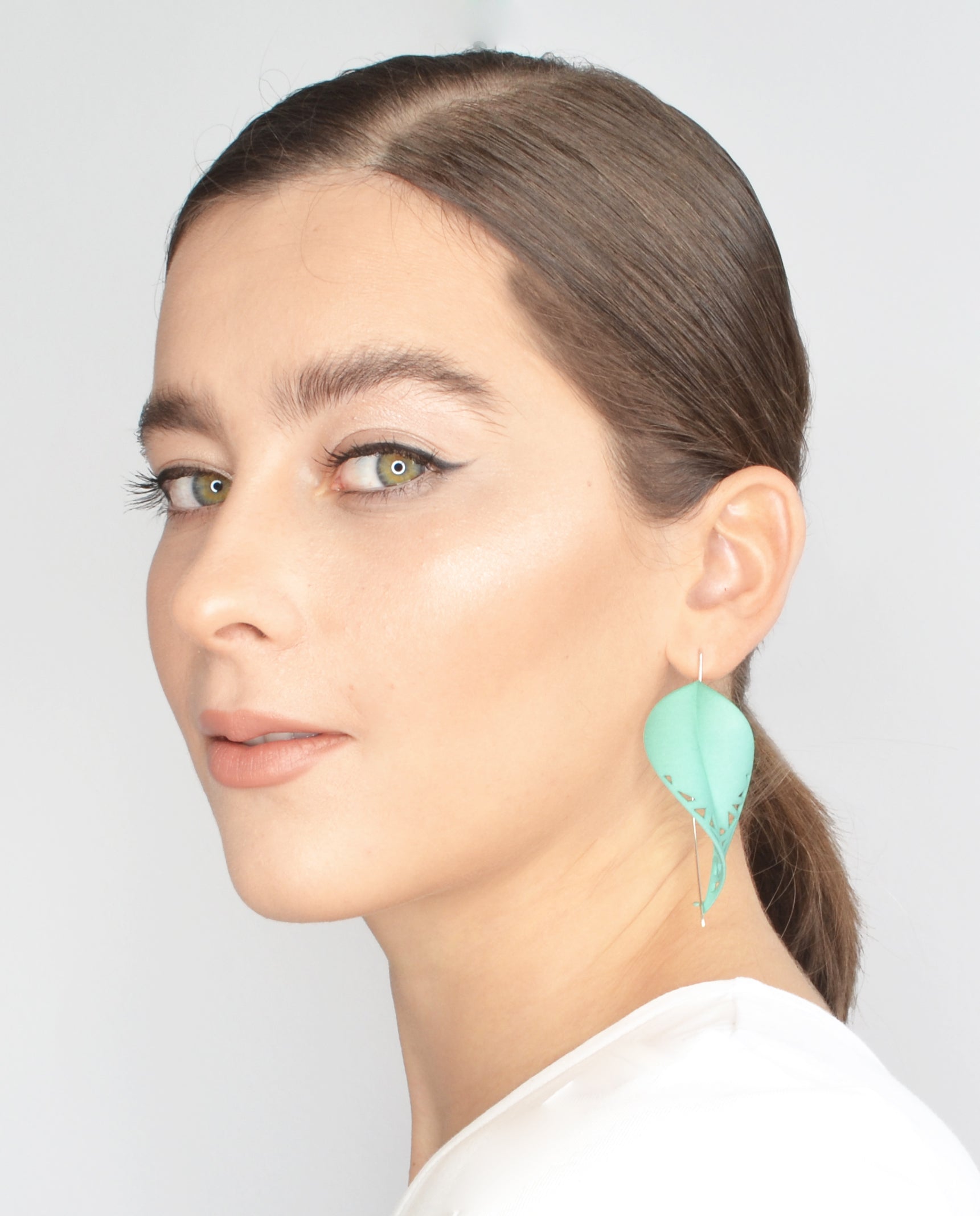Oversize Leaf Earrings in vibrant colors inspired by rainforest flora, featuring a lightweight design and hypoallergenic materials.
