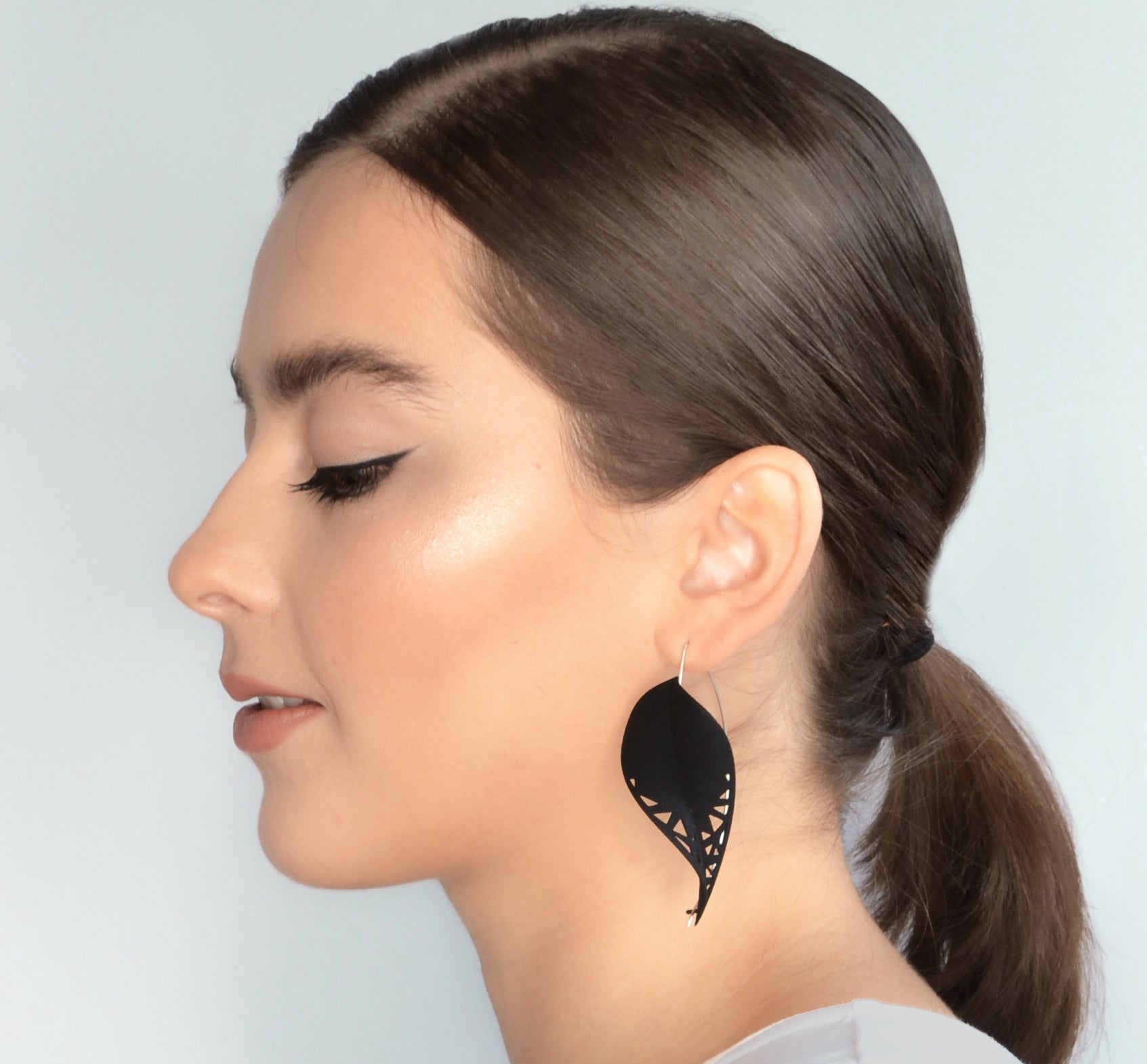 Oversize Leaf Earrings in vibrant colors inspired by rainforest flora, featuring a lightweight design and hypoallergenic materials.