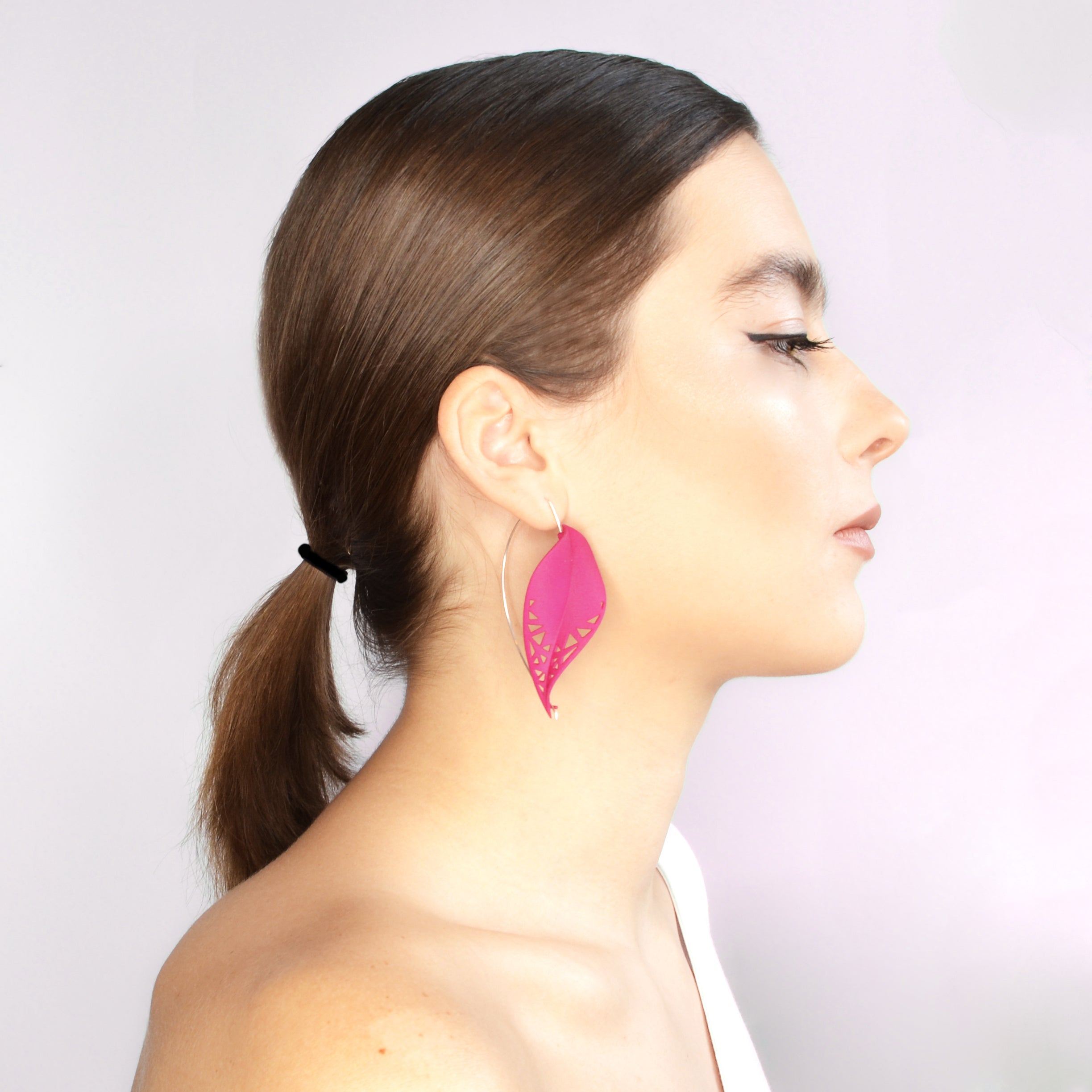 Oversize Leaf Earrings in vibrant colors inspired by rainforest flora, featuring a lightweight design and hypoallergenic materials.