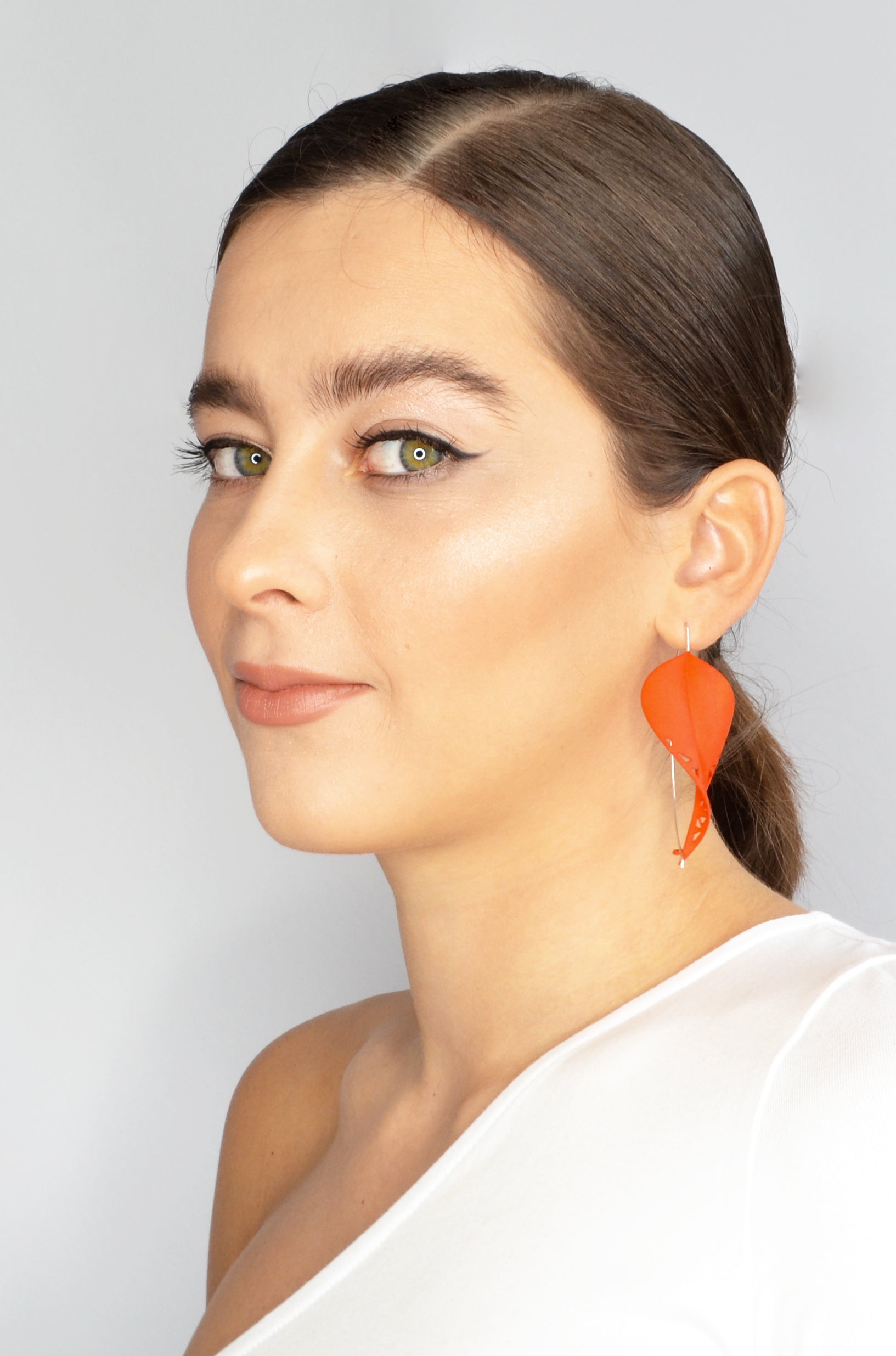 Oversize Leaf Earrings in vibrant colors inspired by rainforest flora, featuring a lightweight design and hypoallergenic materials.