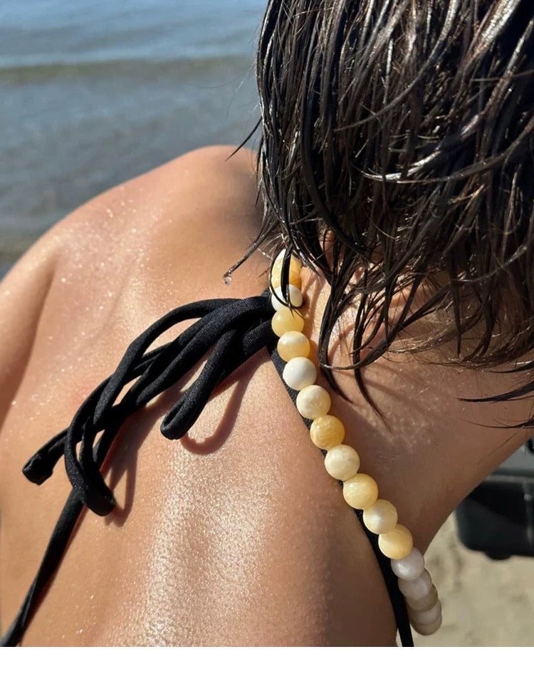 A vibrant Lemon Drop Delight Yellow Jade Necklace featuring naturally formed yellow jade stones resembling lemon candies, perfect for summer styling.