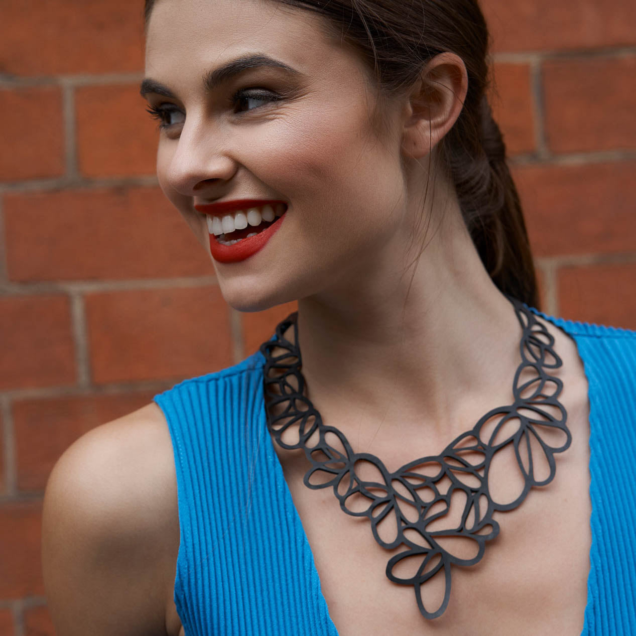 Lilac Statement Inner Tube Necklace handcrafted from reclaimed rubber, featuring an off-centre design and lightweight cord.