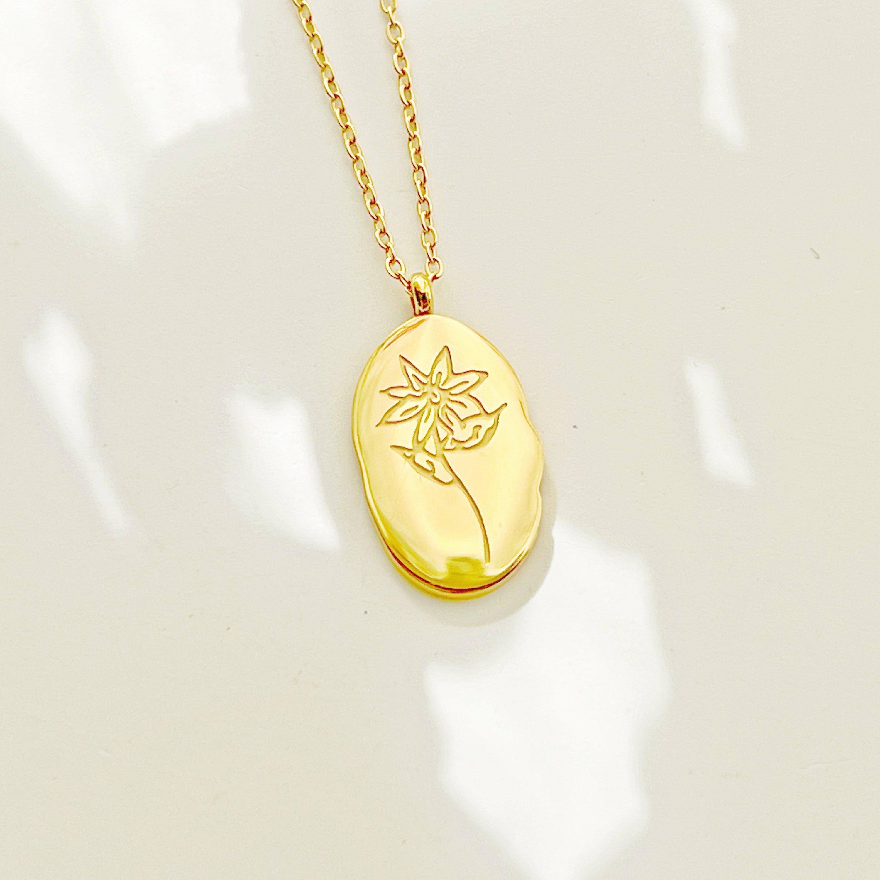Gold plated stainless steel lily pendant necklace with adjustable chain, elegantly designed for May birthdays.