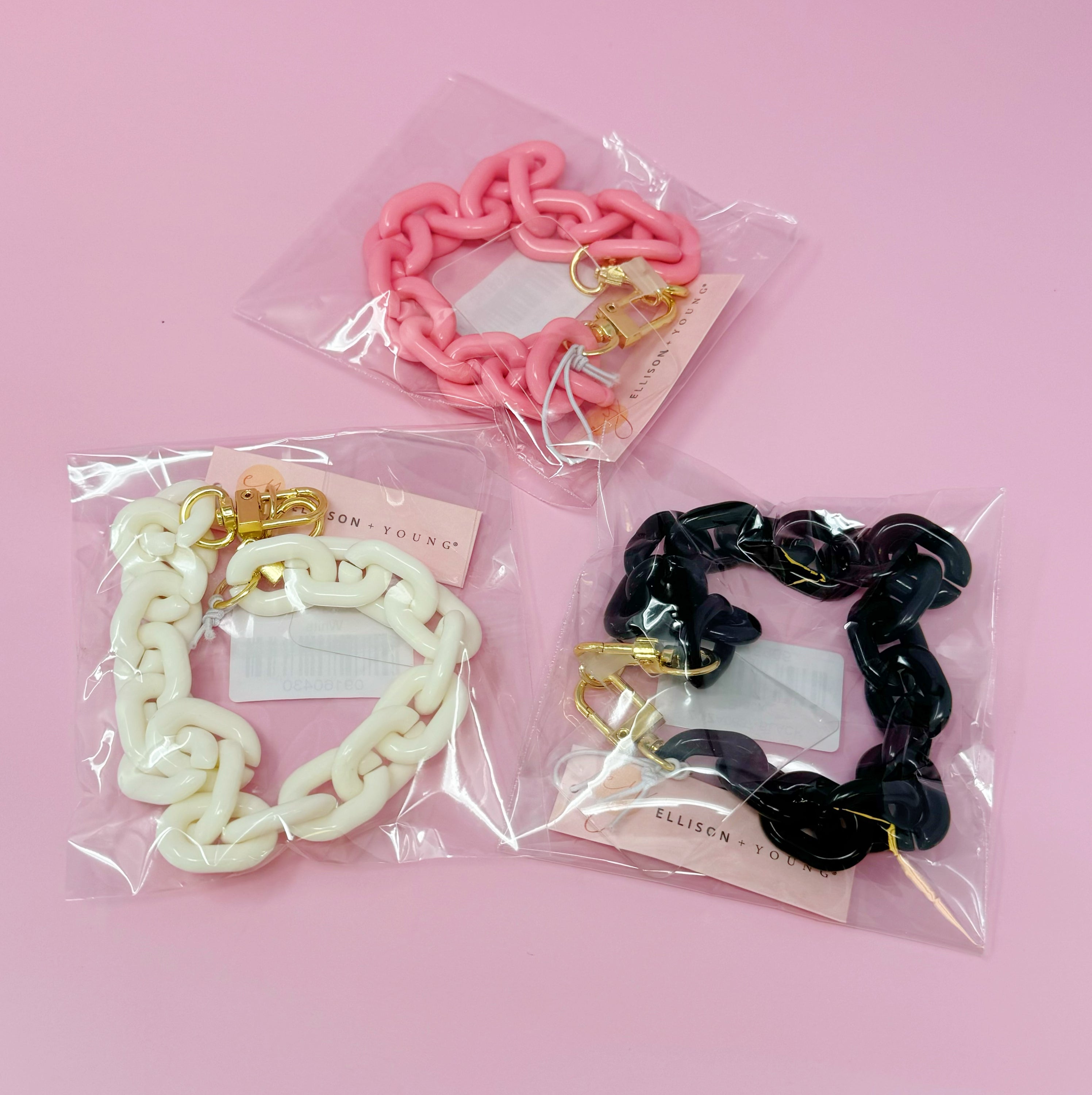 Link Multi Function Phone Wrist Lanyard featuring a lightweight acrylic chain with golden hardware, ideal for attaching to phones, wallets, or keys.