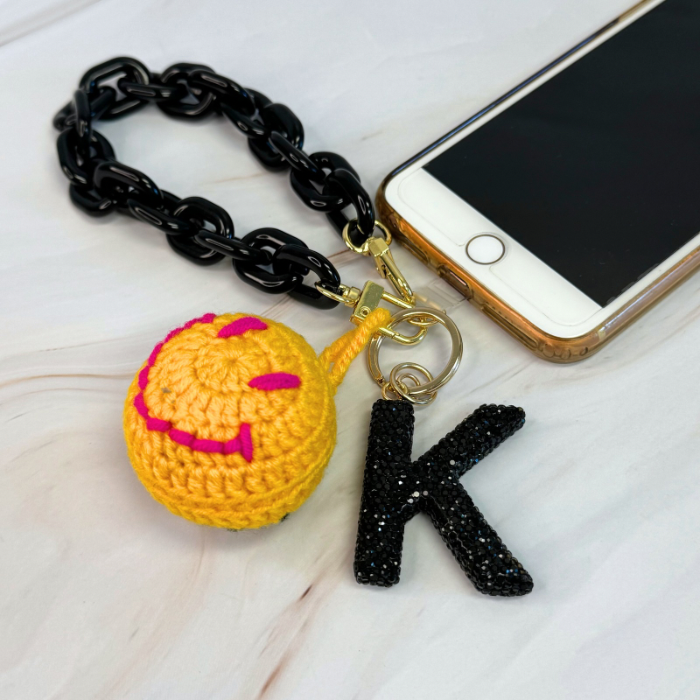 Link Multi Function Phone Wrist Lanyard featuring a lightweight acrylic chain with golden hardware, ideal for attaching to phones, wallets, or keys.