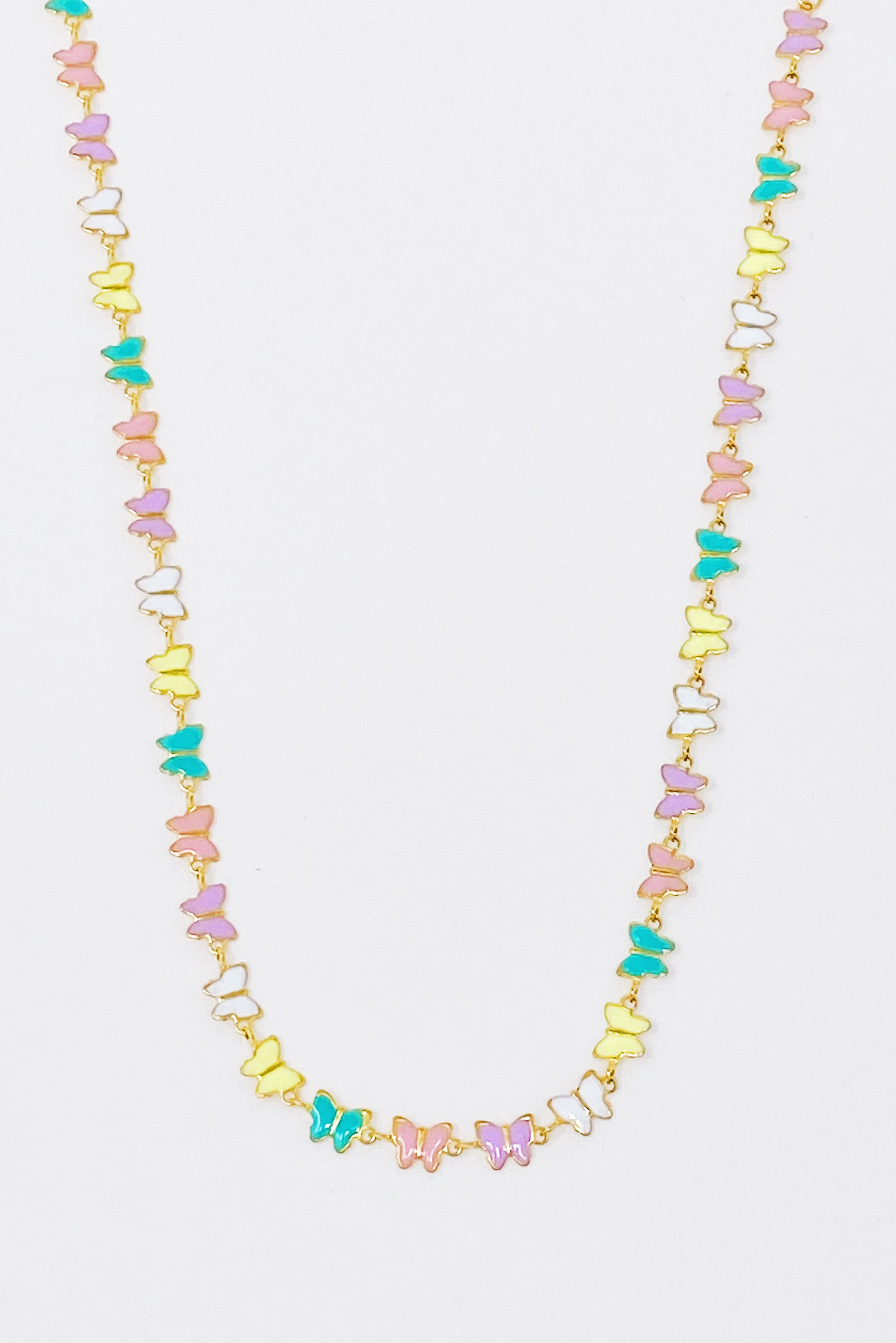 Linked Butterflies Necklace featuring pastel butterflies and a solid gold reversible side, crafted from gold plated stainless steel.