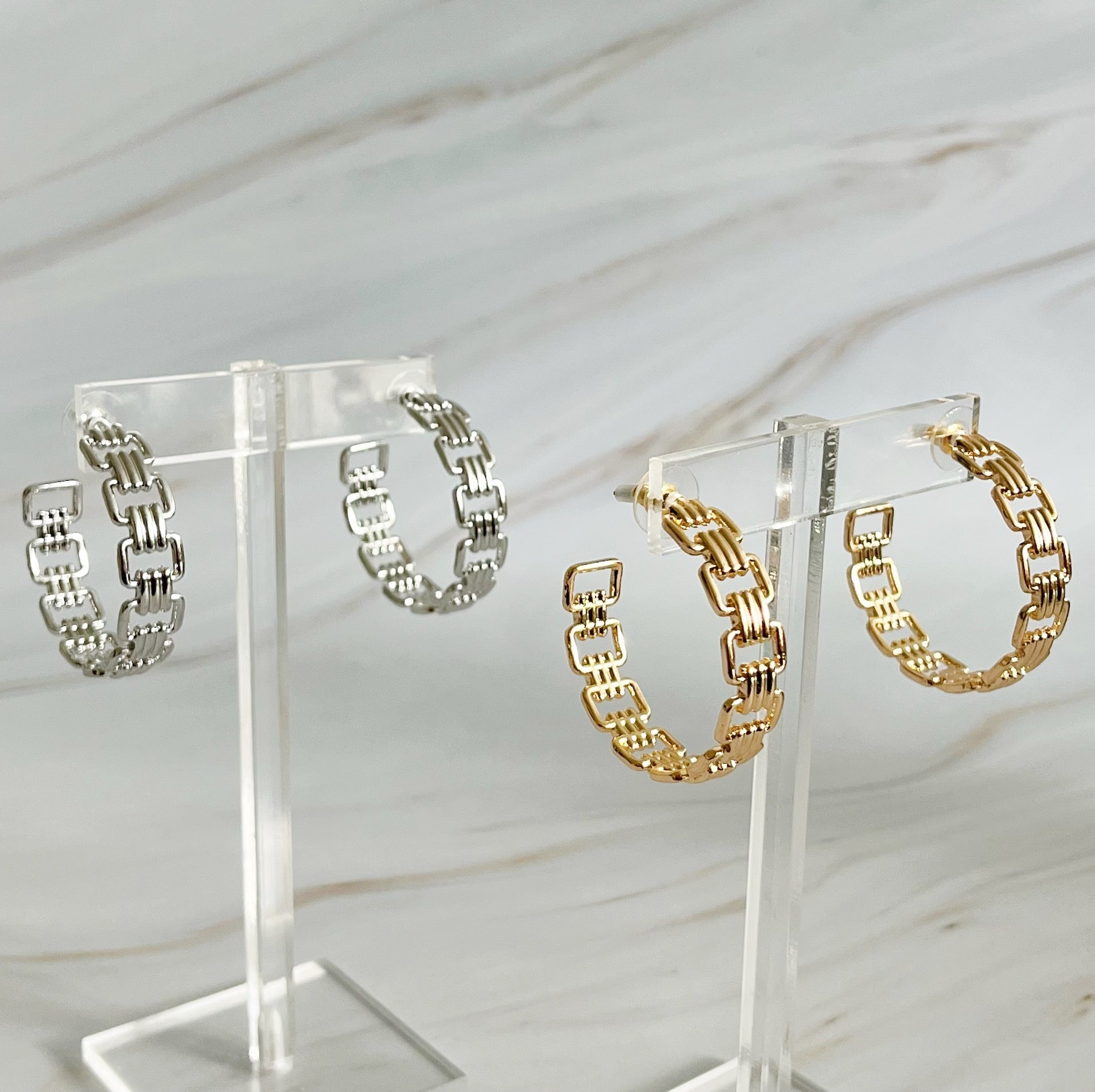 Elegant Linked Golden Hoop Earrings with a modern design, showcasing a unique linked pattern and a beautiful golden finish.