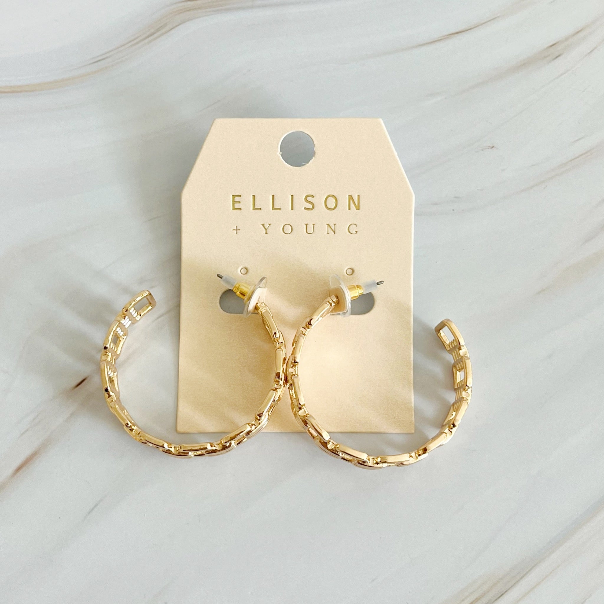 Elegant Linked Golden Hoop Earrings with a modern design, showcasing a unique linked pattern and a beautiful golden finish.