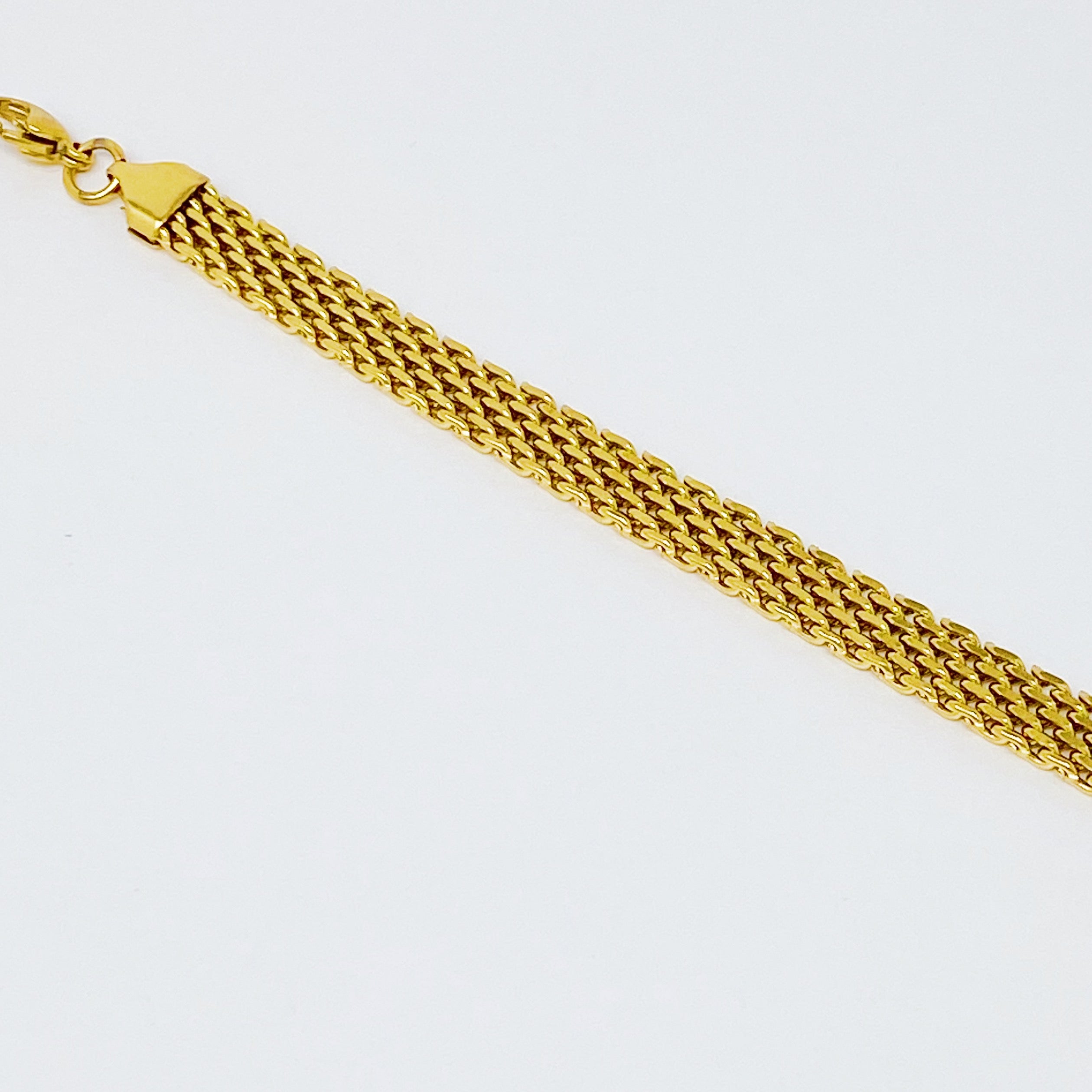 A stylish Links All Around Bracelet featuring a mesh gold design, adjustable length, and high-quality stainless steel construction.