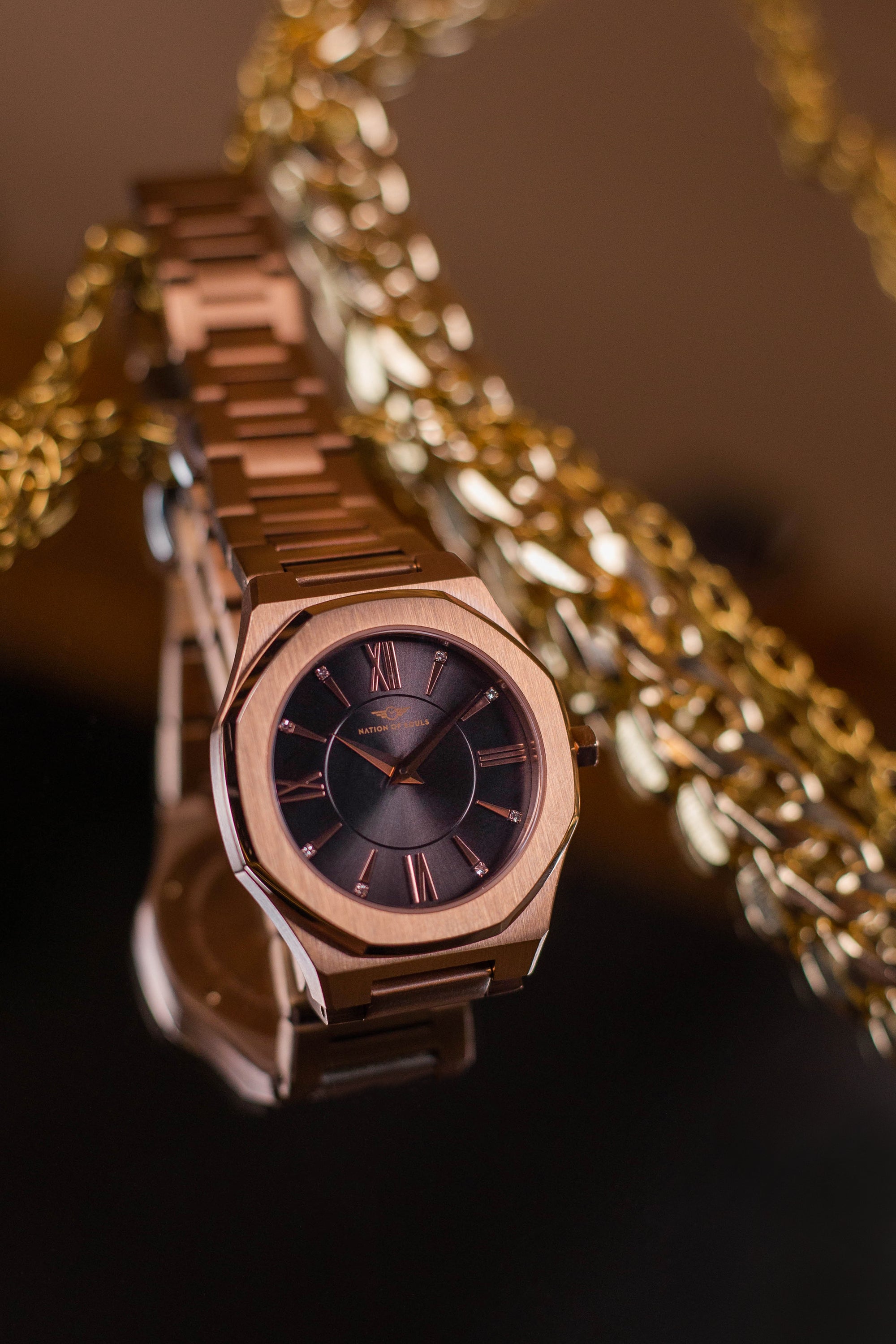 Livia Rose Gold - Smoke watch featuring Roman numerals and a Sunray dial with a multi-link bracelet.