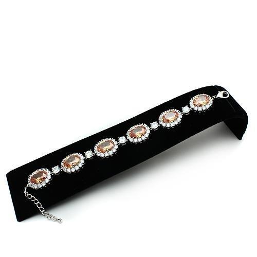 Rhodium brass bracelet featuring AAA Grade CZ stone in champagne color, showcasing its elegant design and luxurious finish.