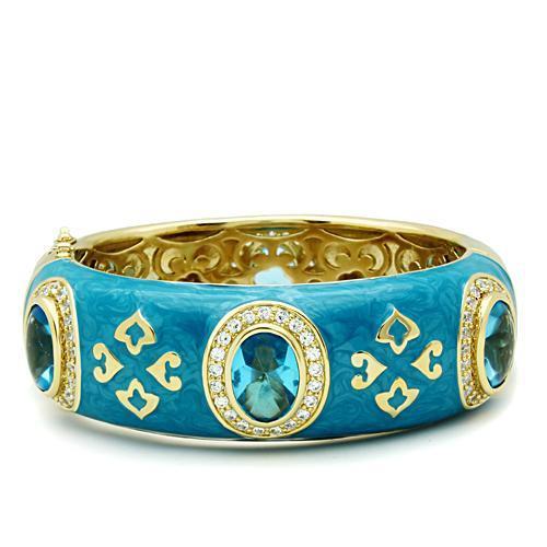 LO2250 Gold Brass Bangle featuring Sea Blue Synthetic Glass, elegantly designed with a luxurious gold finish.