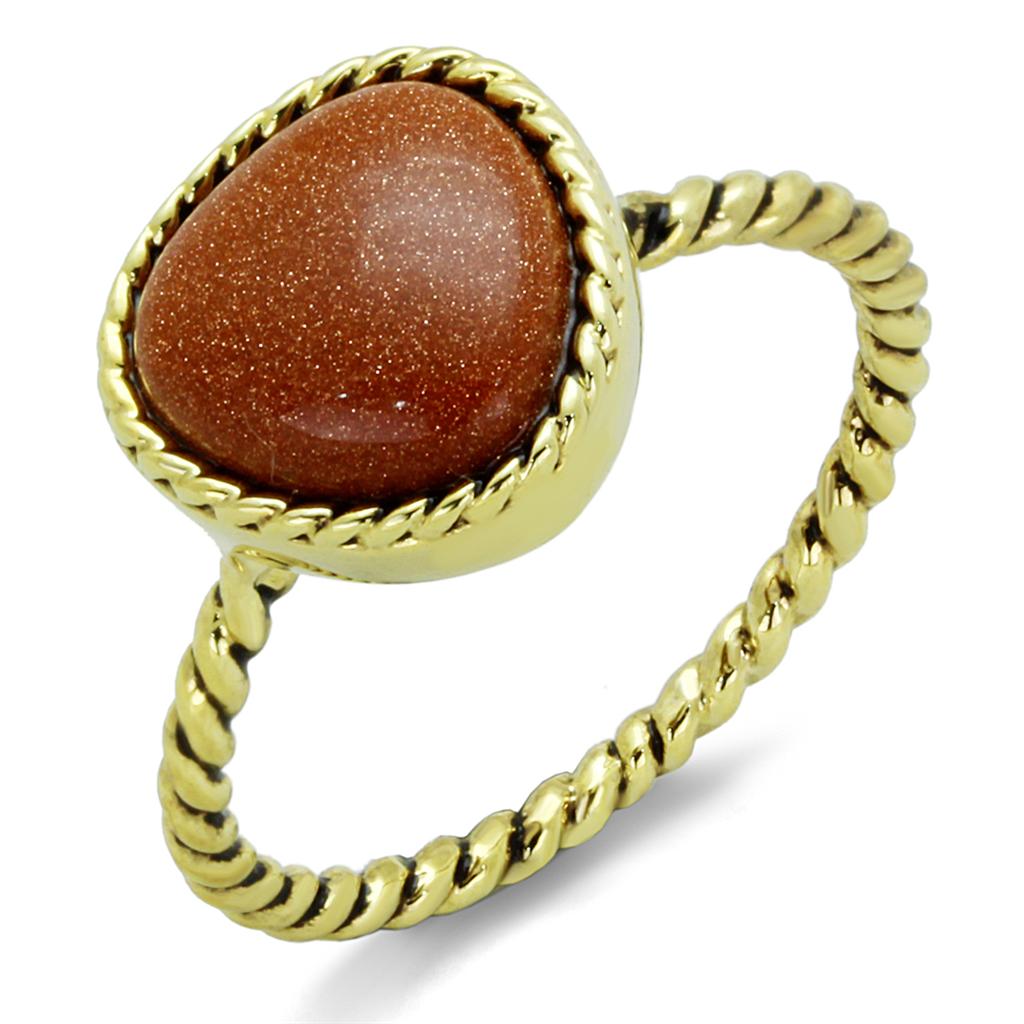 A beautiful gold brass ring featuring a brown synthetic cat eye stone, showcasing elegance and craftsmanship.